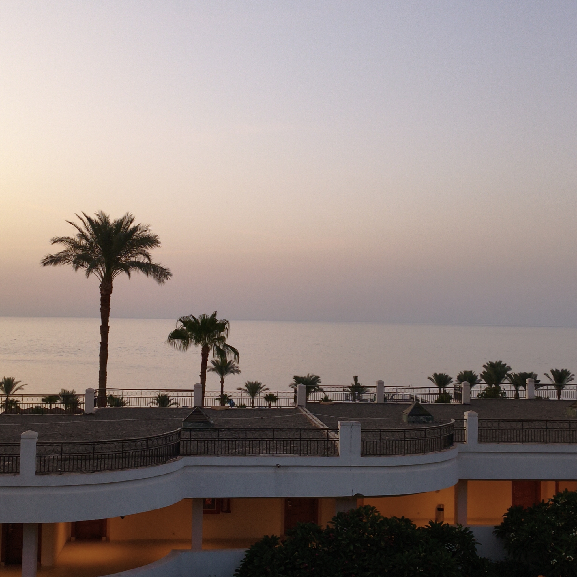 Dusk settles over a tropical beachfront resort