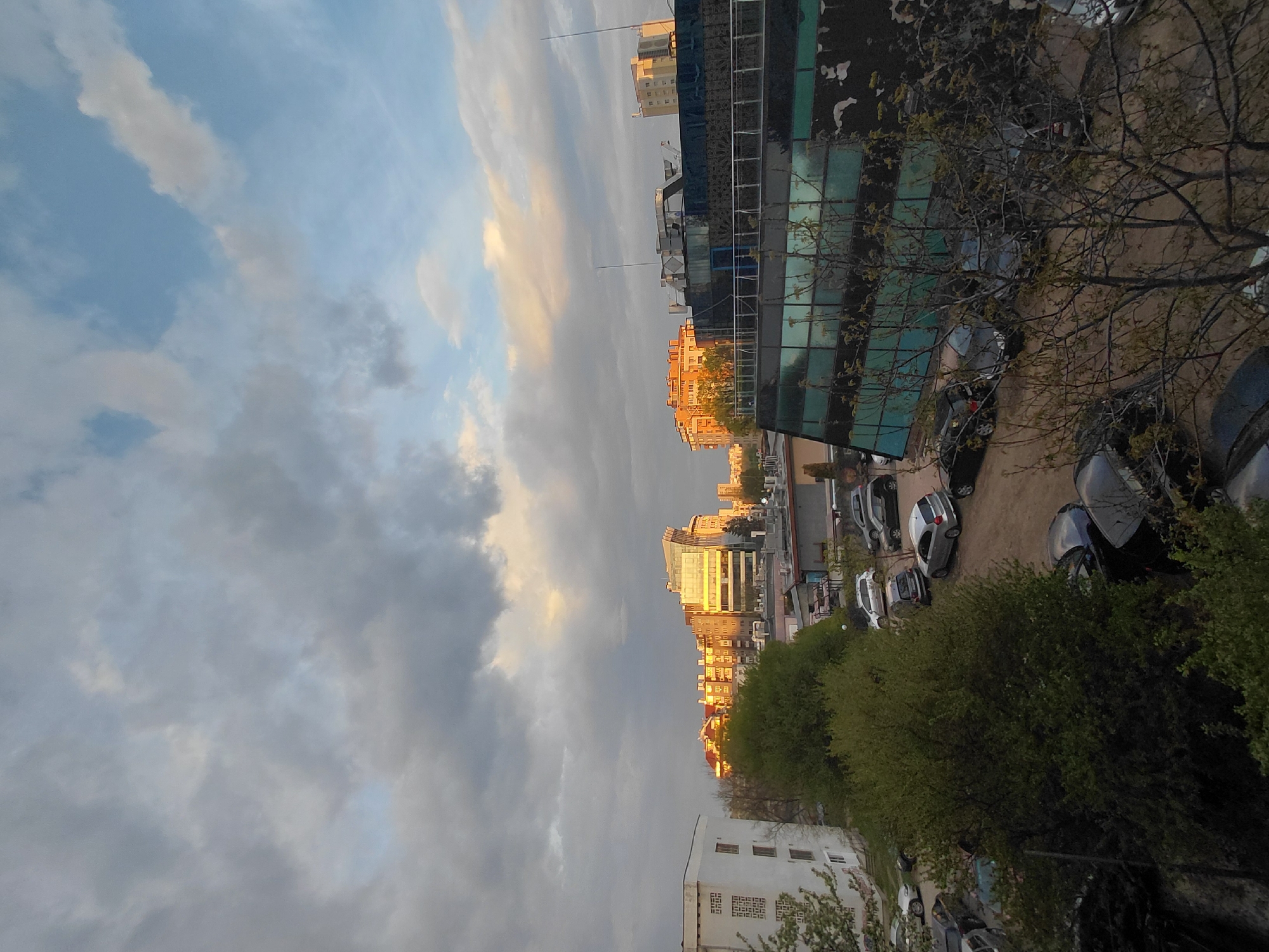 Observer documents Sofia cityscape during sunset hours