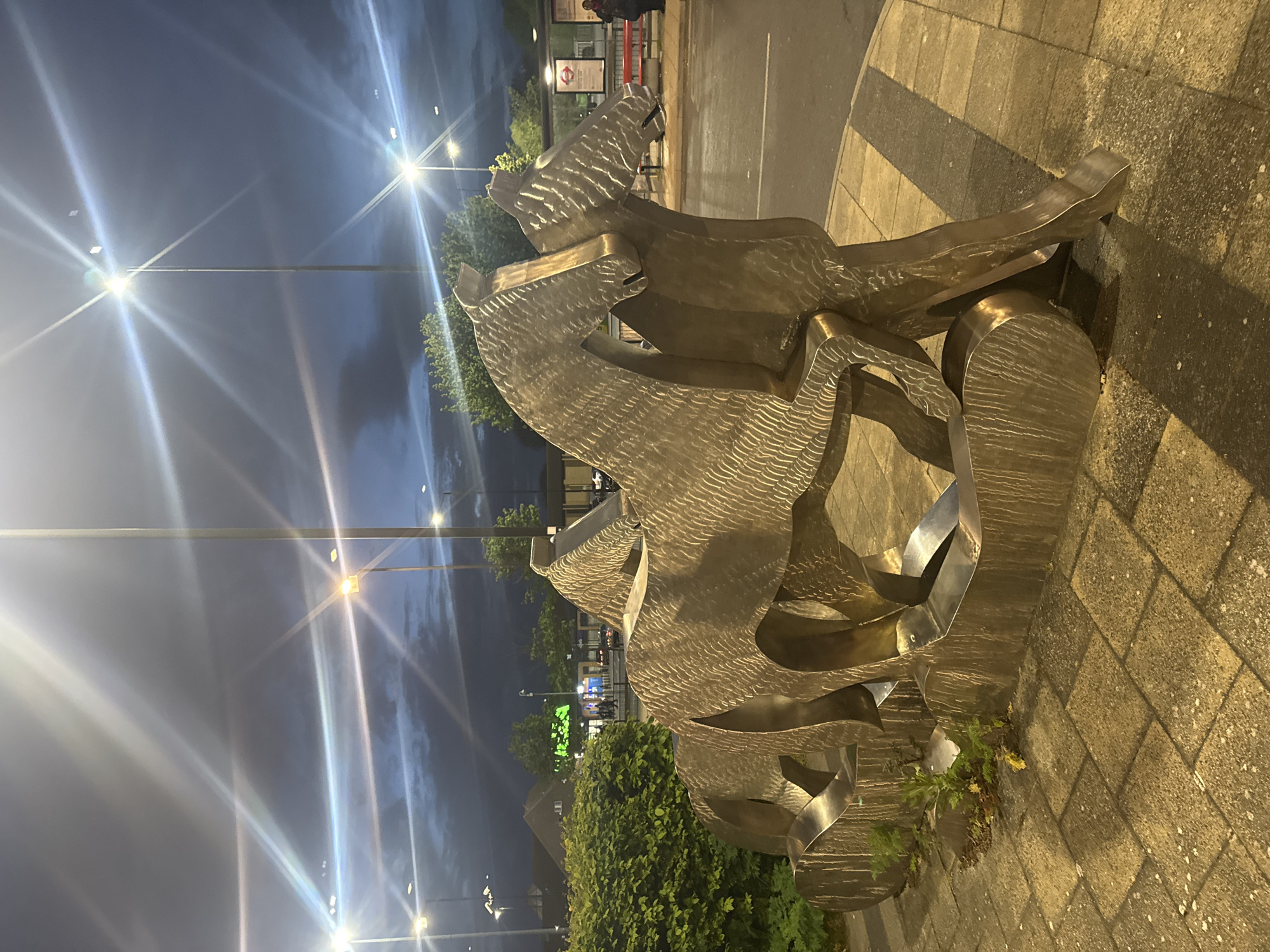 Large metallic sculpture observed on London street at night