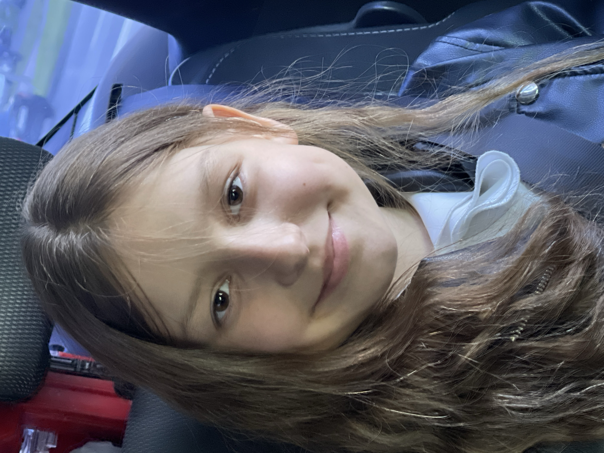 Girl with smartphone observed in car in Stavropol