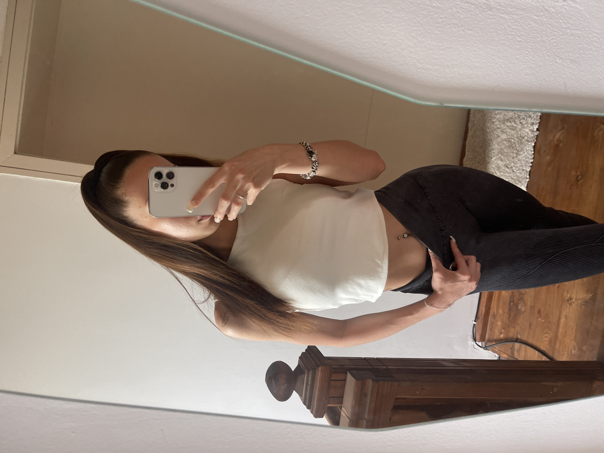 Woman documents casual day with mirror selfies and poolside moments