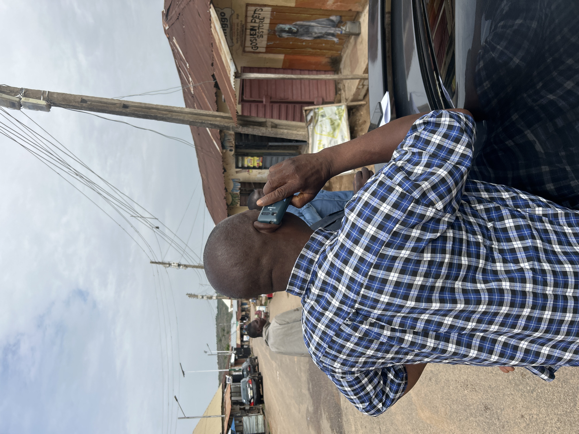 Campaign workers post election materials for candidate in Jos