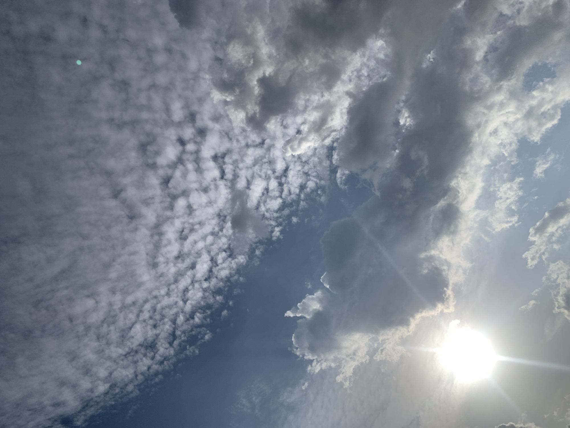 Sunlit sky and a close-up portrait moment in Jos, Nigeria