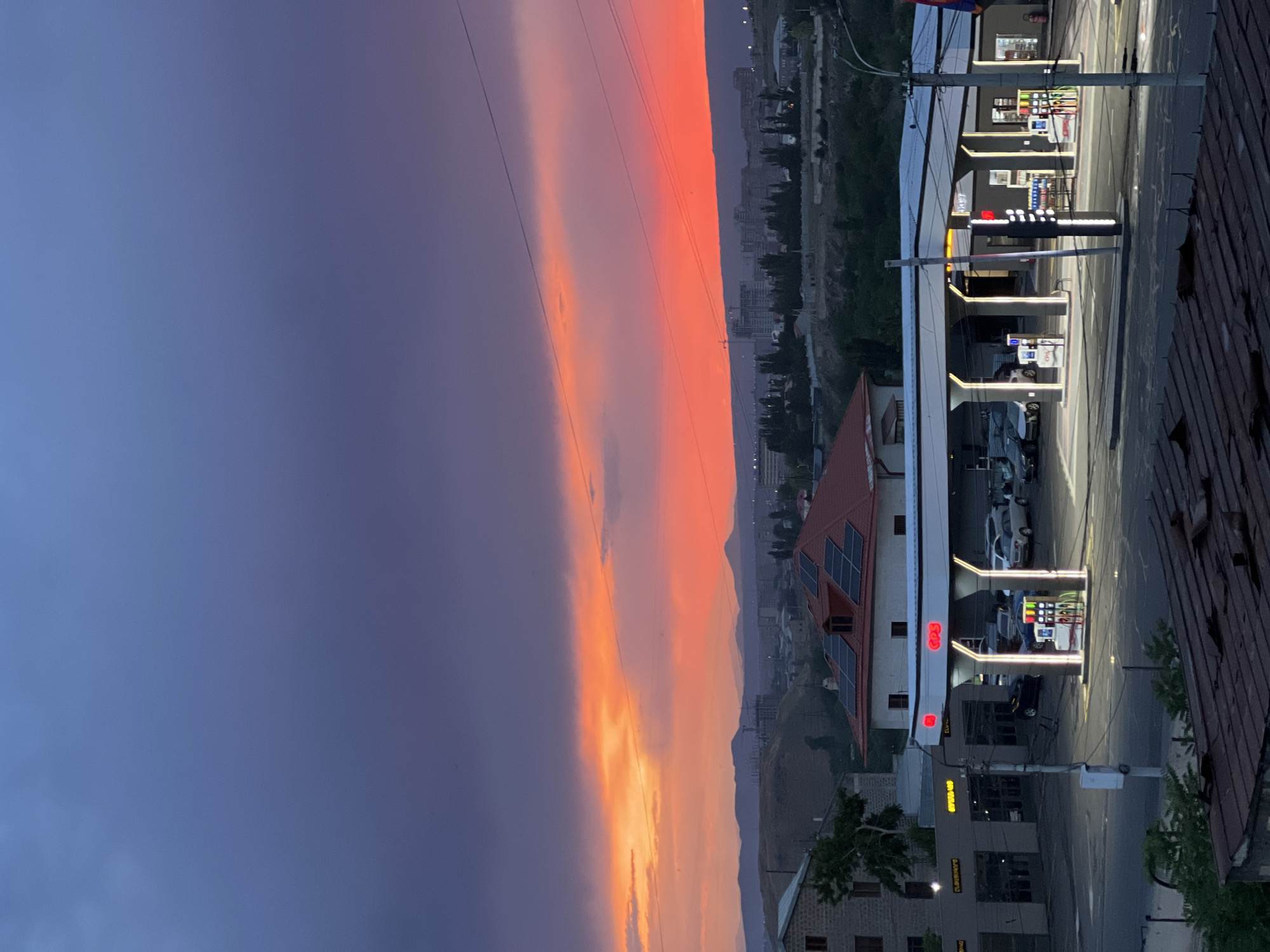 Sunset observed over Yerevan cityscape during evening twilight