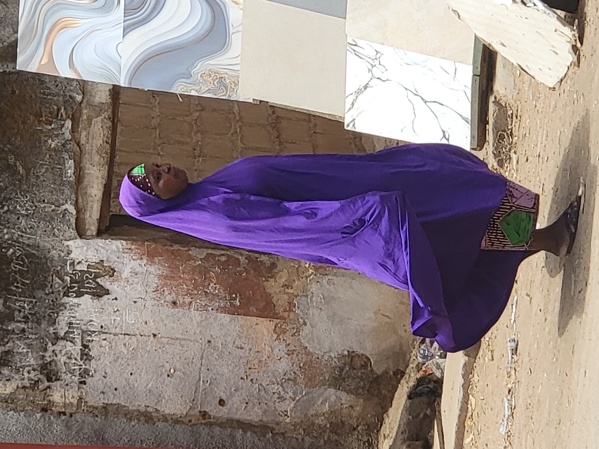 Daily street commerce unfolds in Maiburiji, Nigeria morning hours