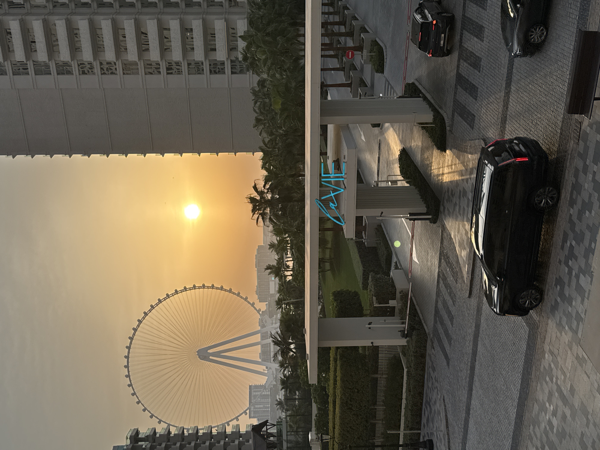 Dubai waterfront at golden hour, Ain Dubai and jet skis