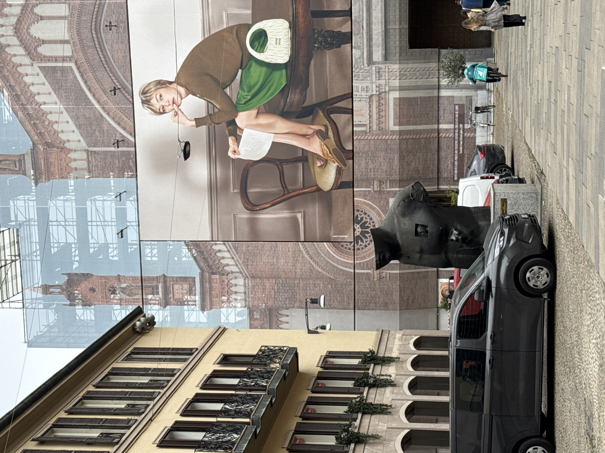 Milan building renovation documented with prominent banner display