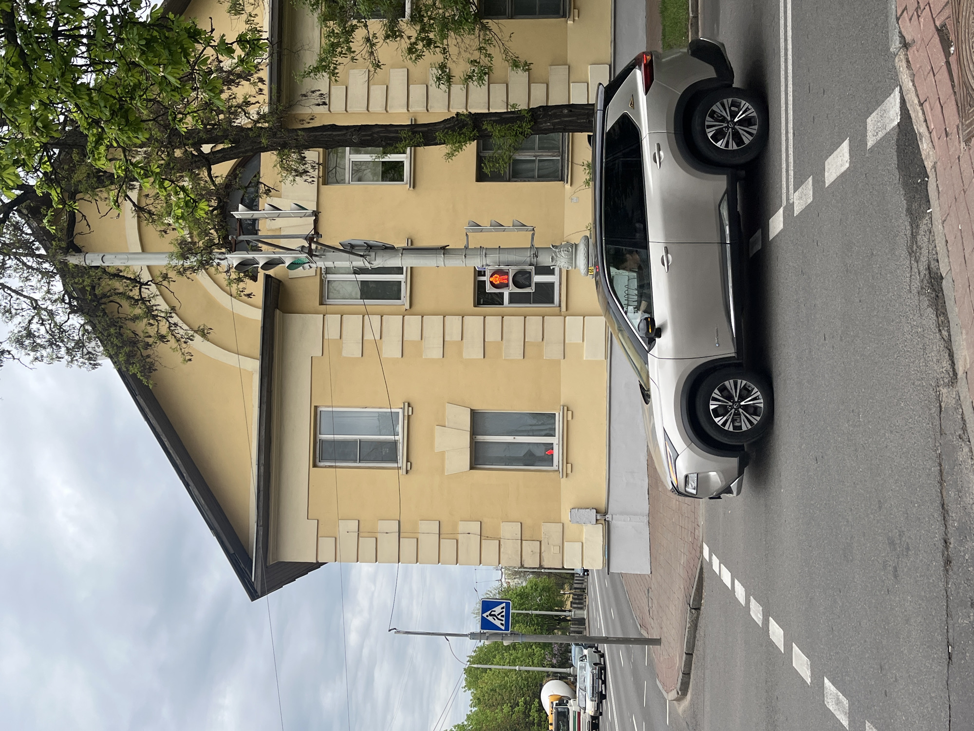 Silver SUV parked on Minsk street blocks sidewalk