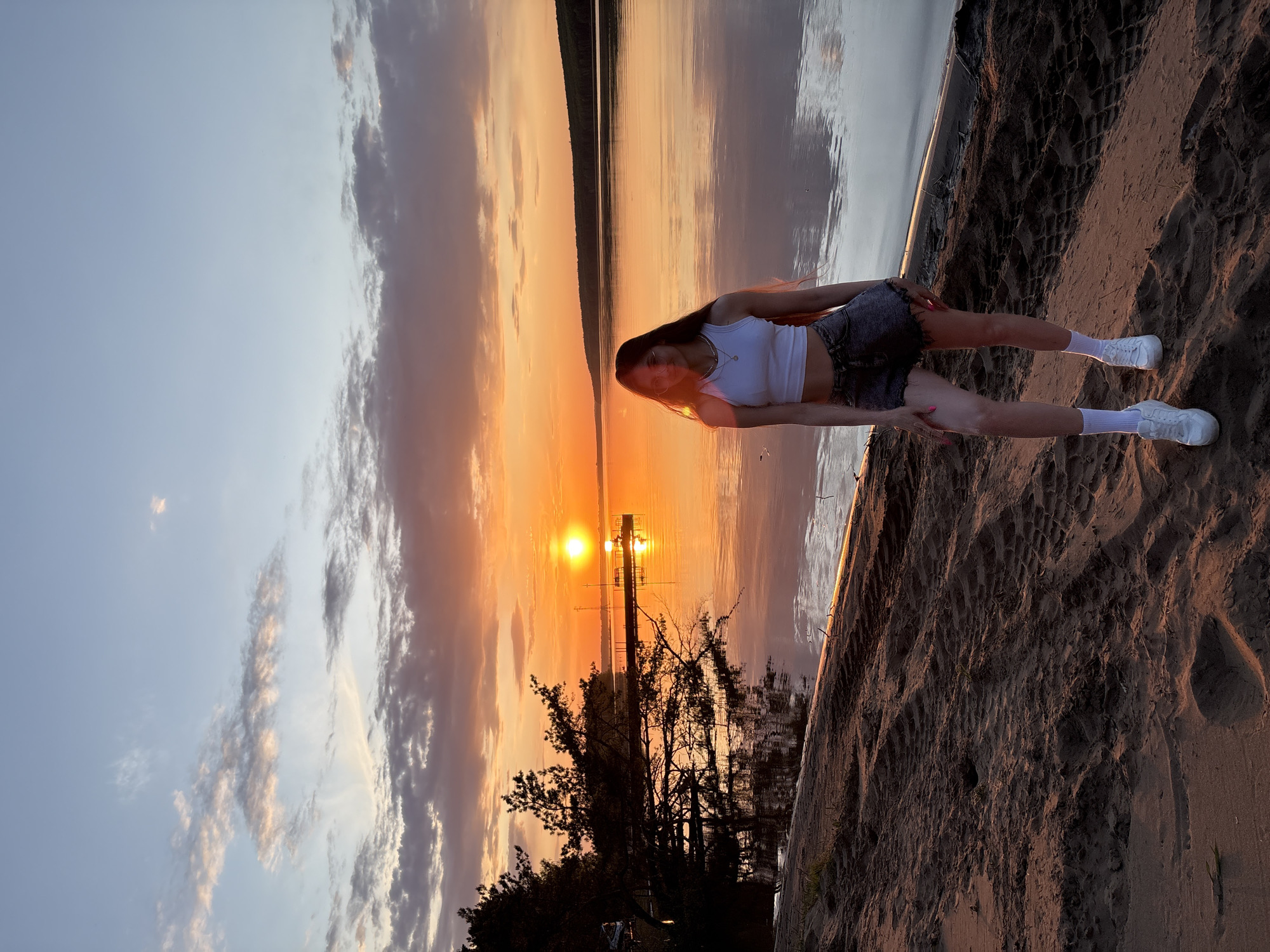 Sunset gathering captured along Kama River beach in Chaykovsky