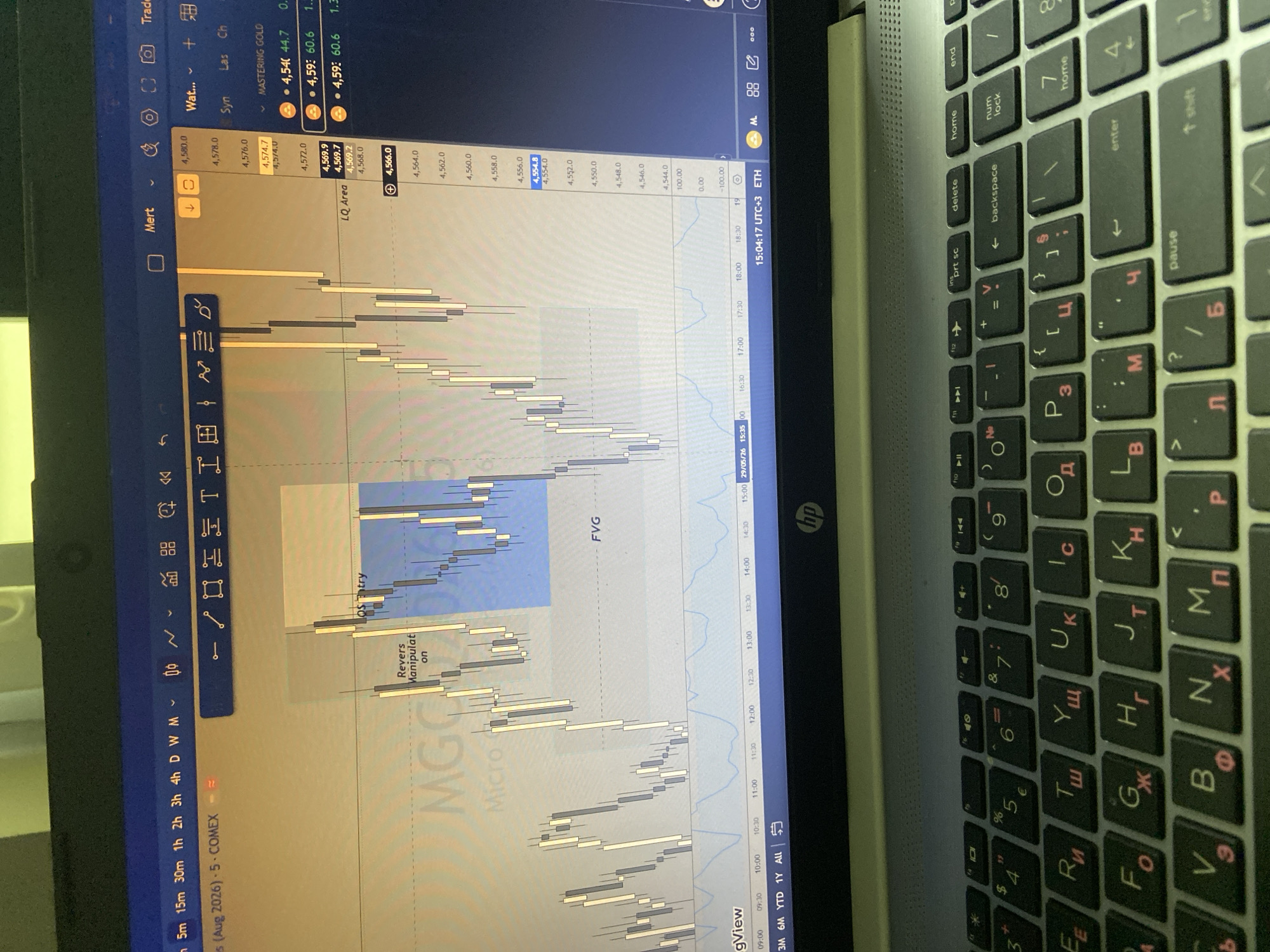 Trader analyzes gold markets with luxury wallet in Bulgaria