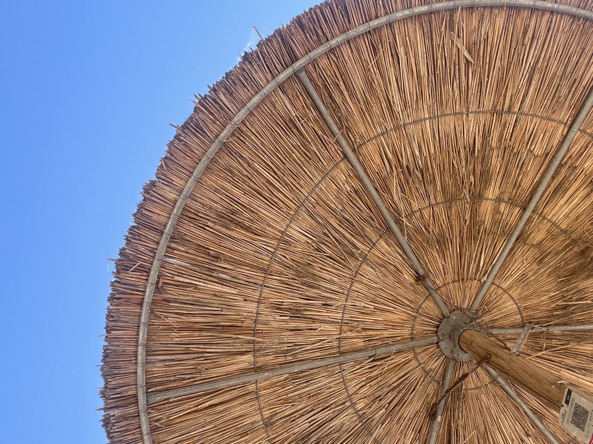 Beach day setup in Chernomorets: straw accessories and iced coffee