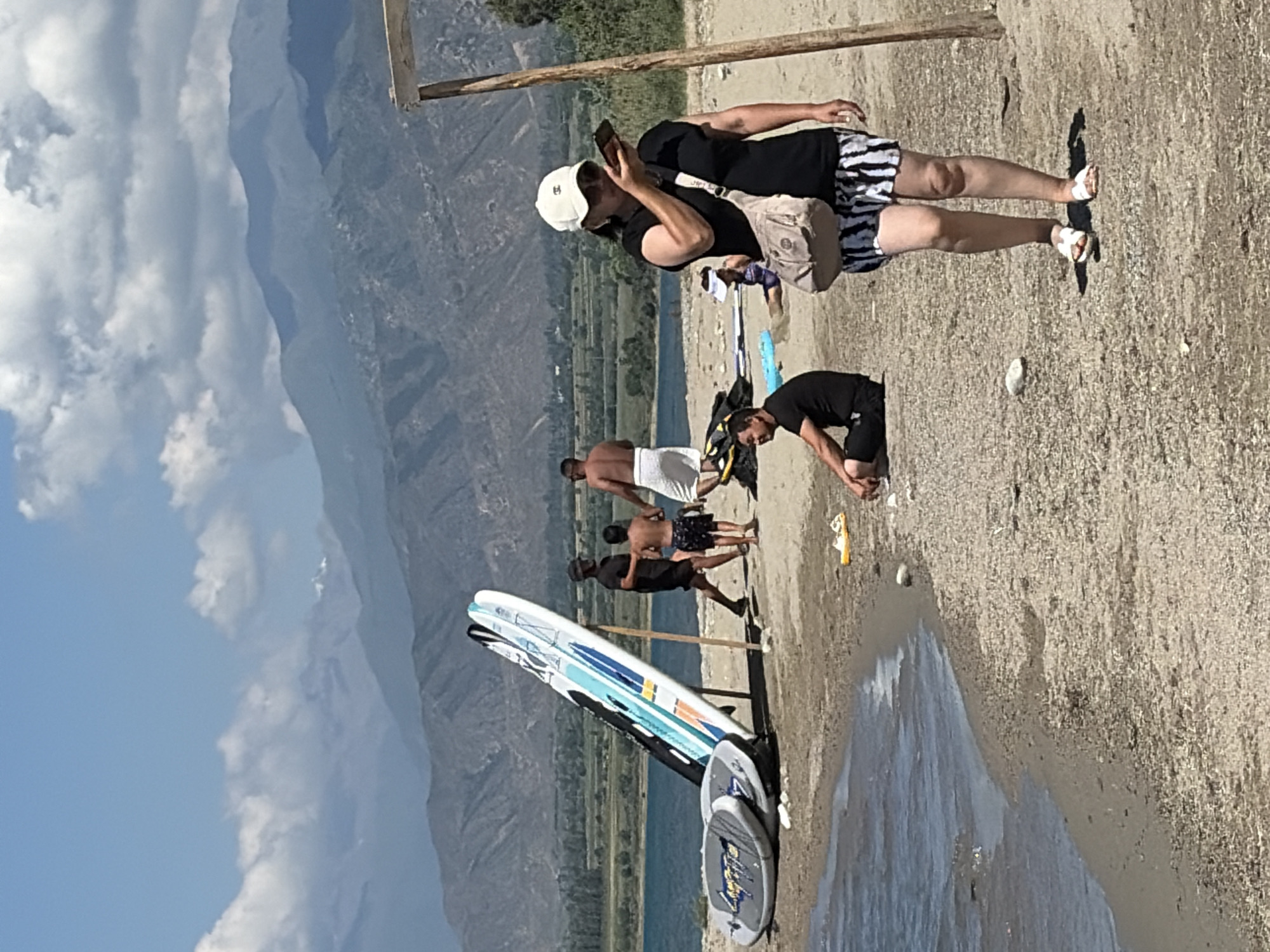 Paddleboarding and beach fun at a mountain lake
