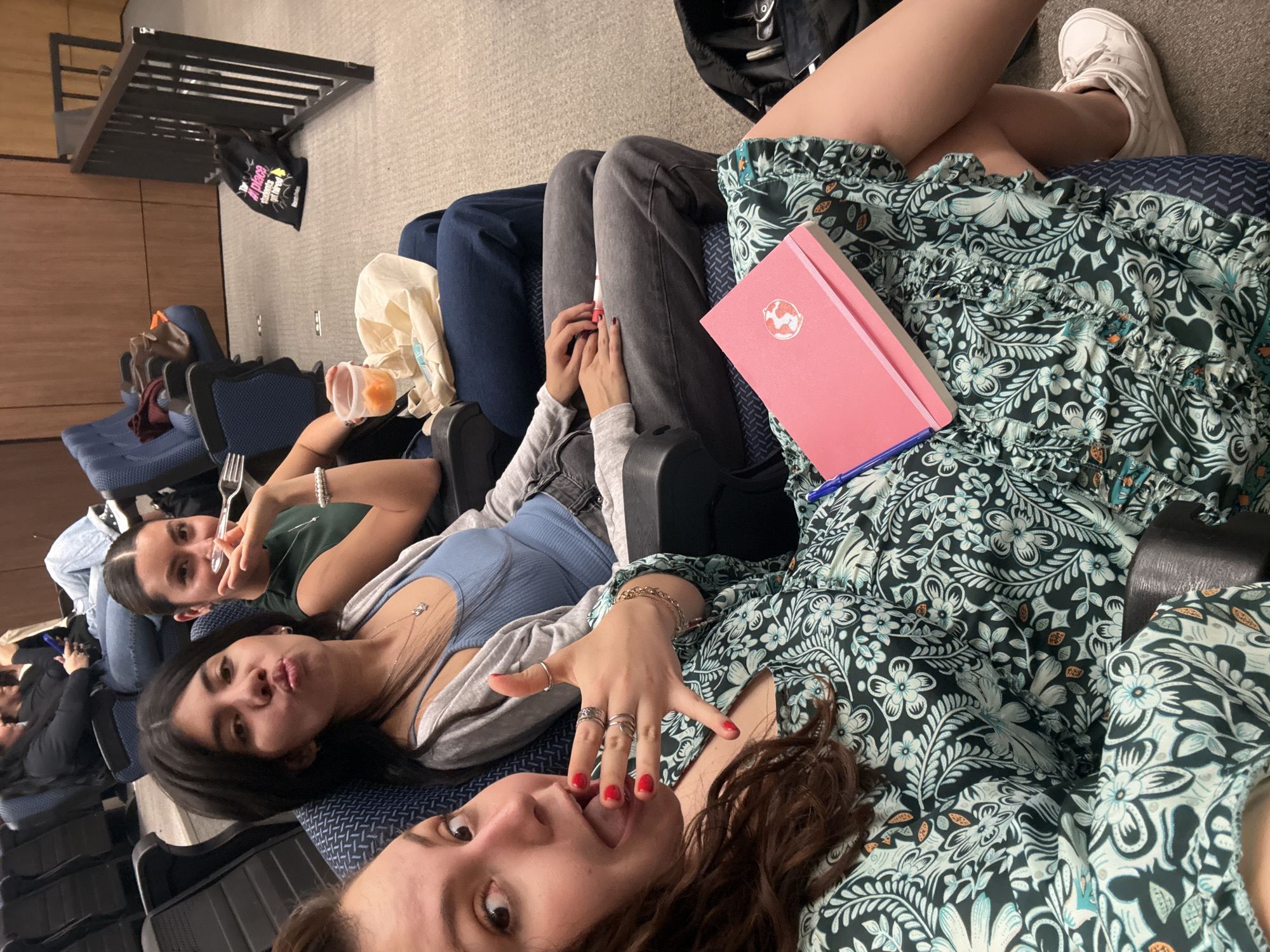 Young women rest in Mexico City theater seats