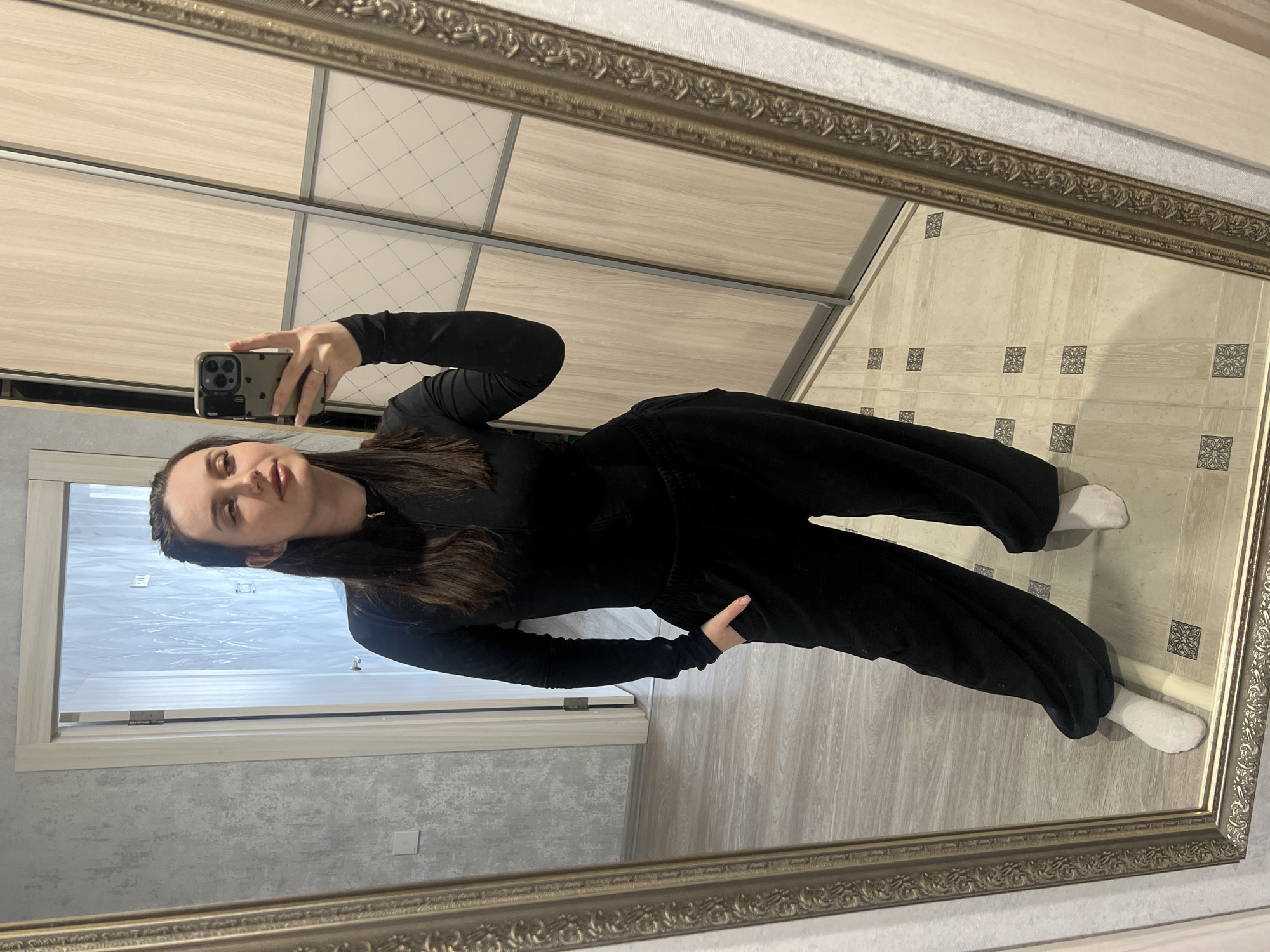 Person takes mirror selfie in Tyumen, Russia