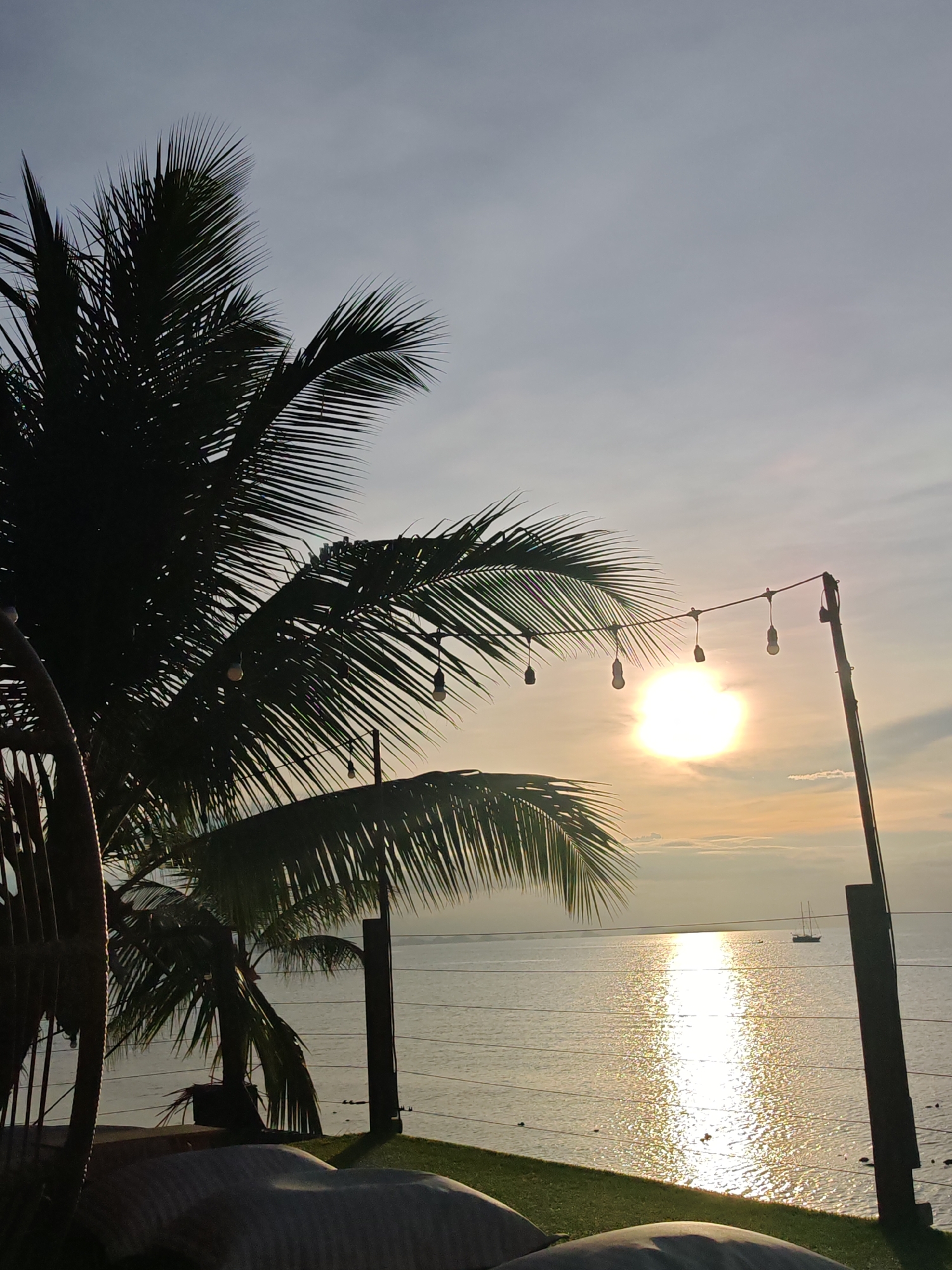 Sunset drinks at a laid-back beach lounge in Baan Tai