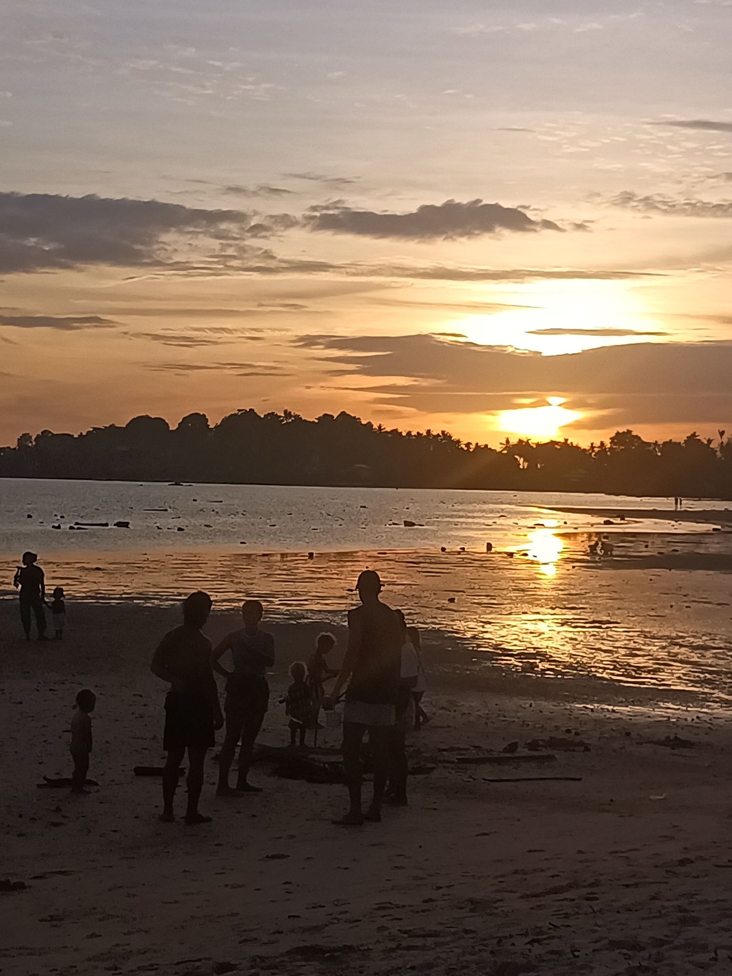 Families enjoy sunset beach time on Koh Phangan