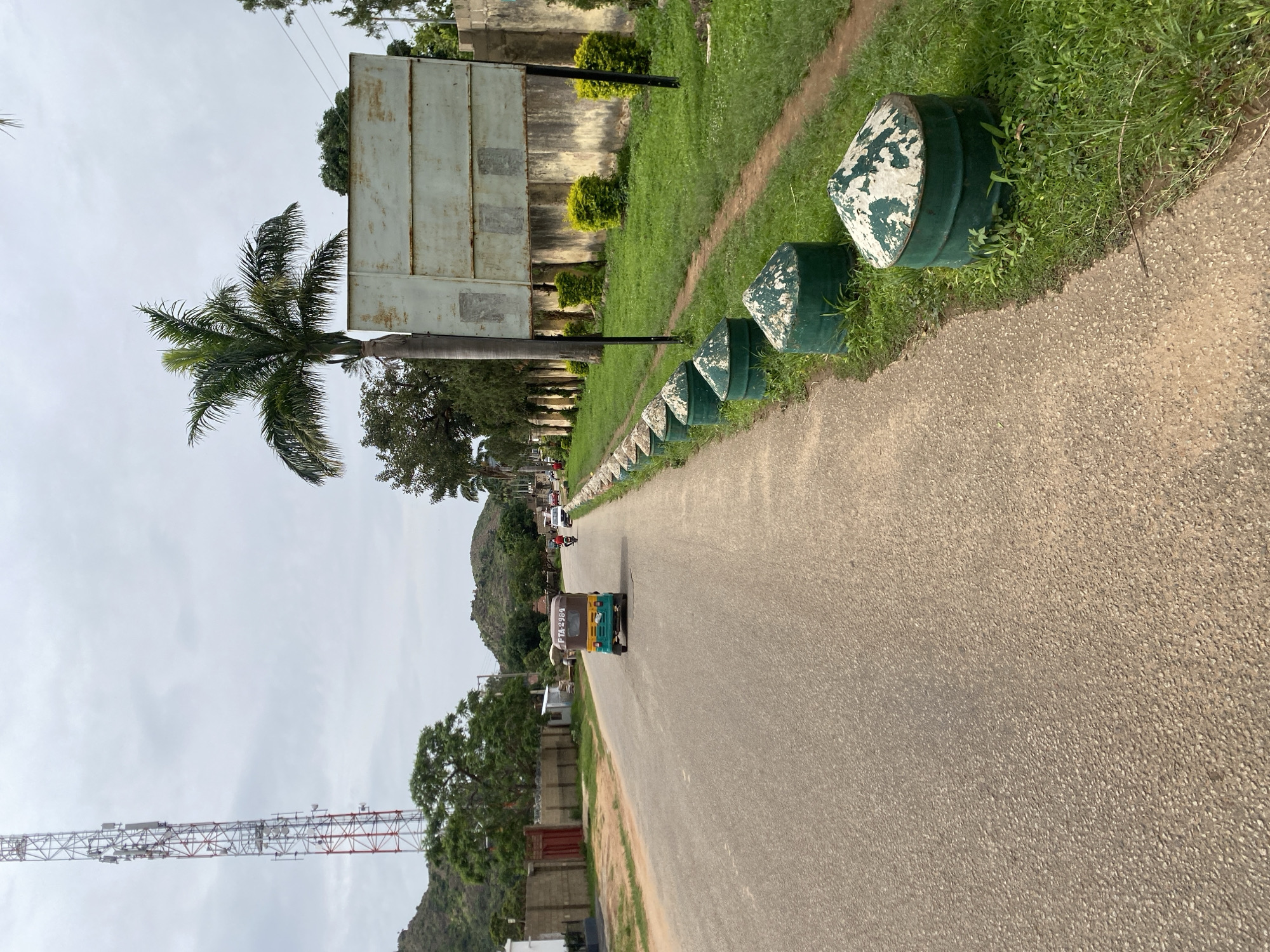 Street-level tour through a Jos neighborhood, mid-afternoon