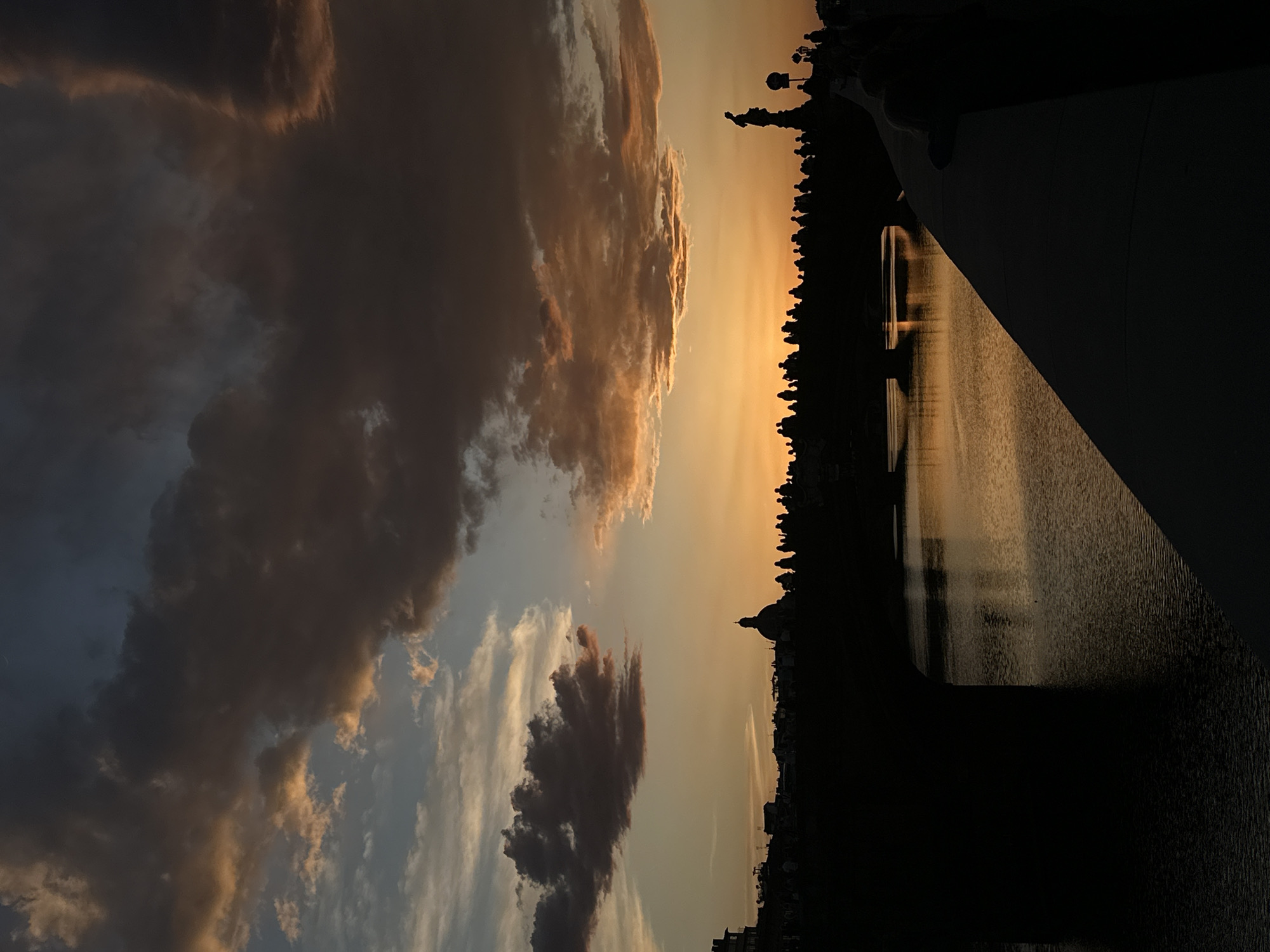 Sunset illuminates Florence's Ponte Vecchio bridge at dusk