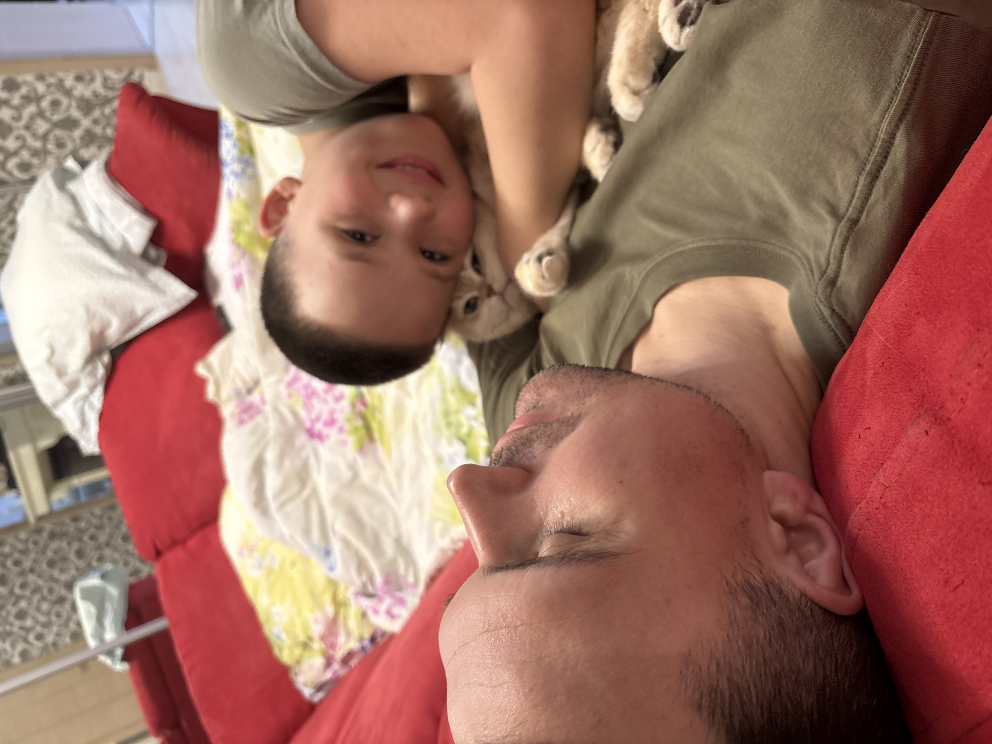 Family relaxes with cat during quiet morning in Chaikovsky