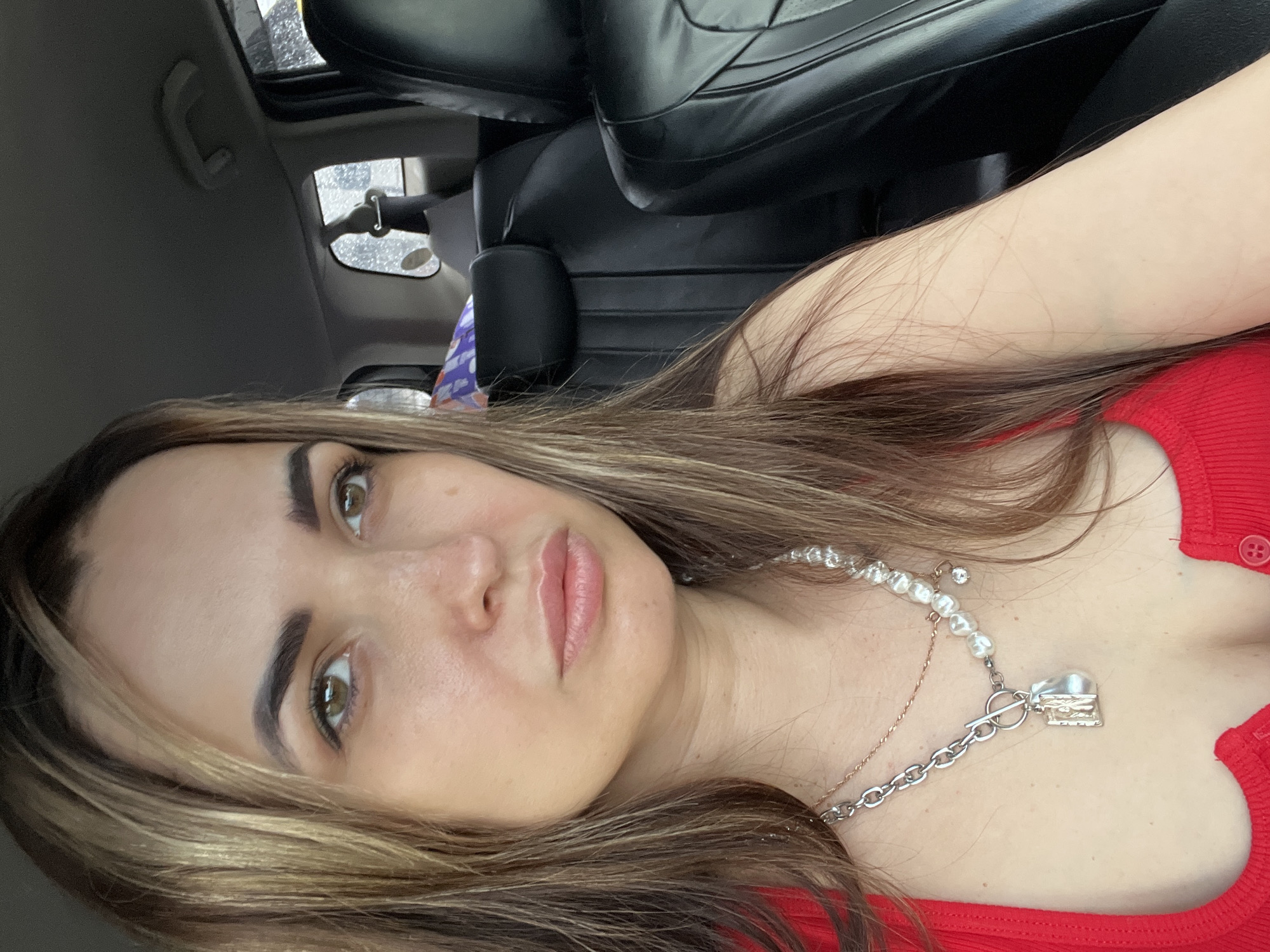 Woman takes multiple selfies inside car during brief morning session