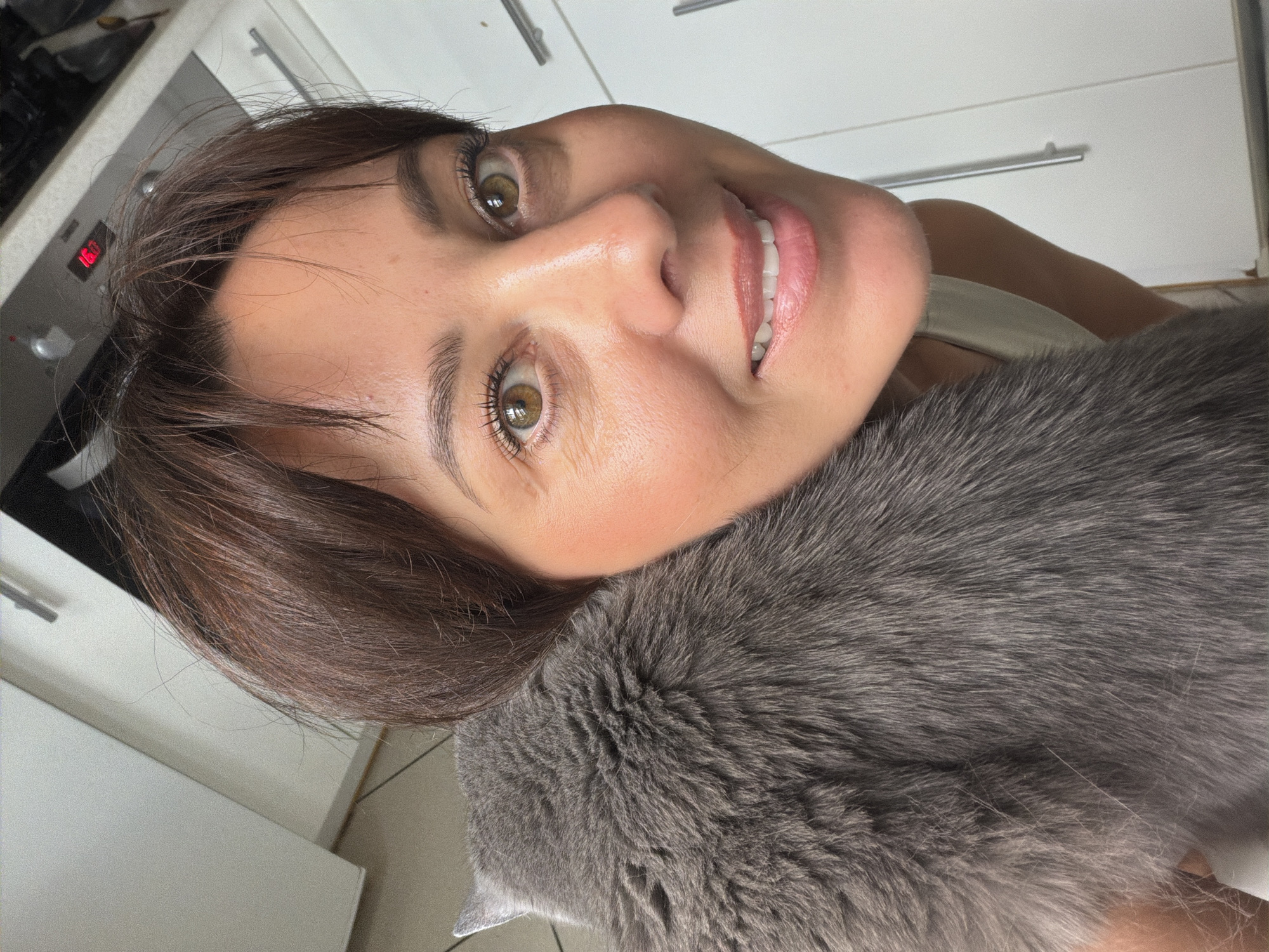 Cozy cat-and-person selfie moment in Riga