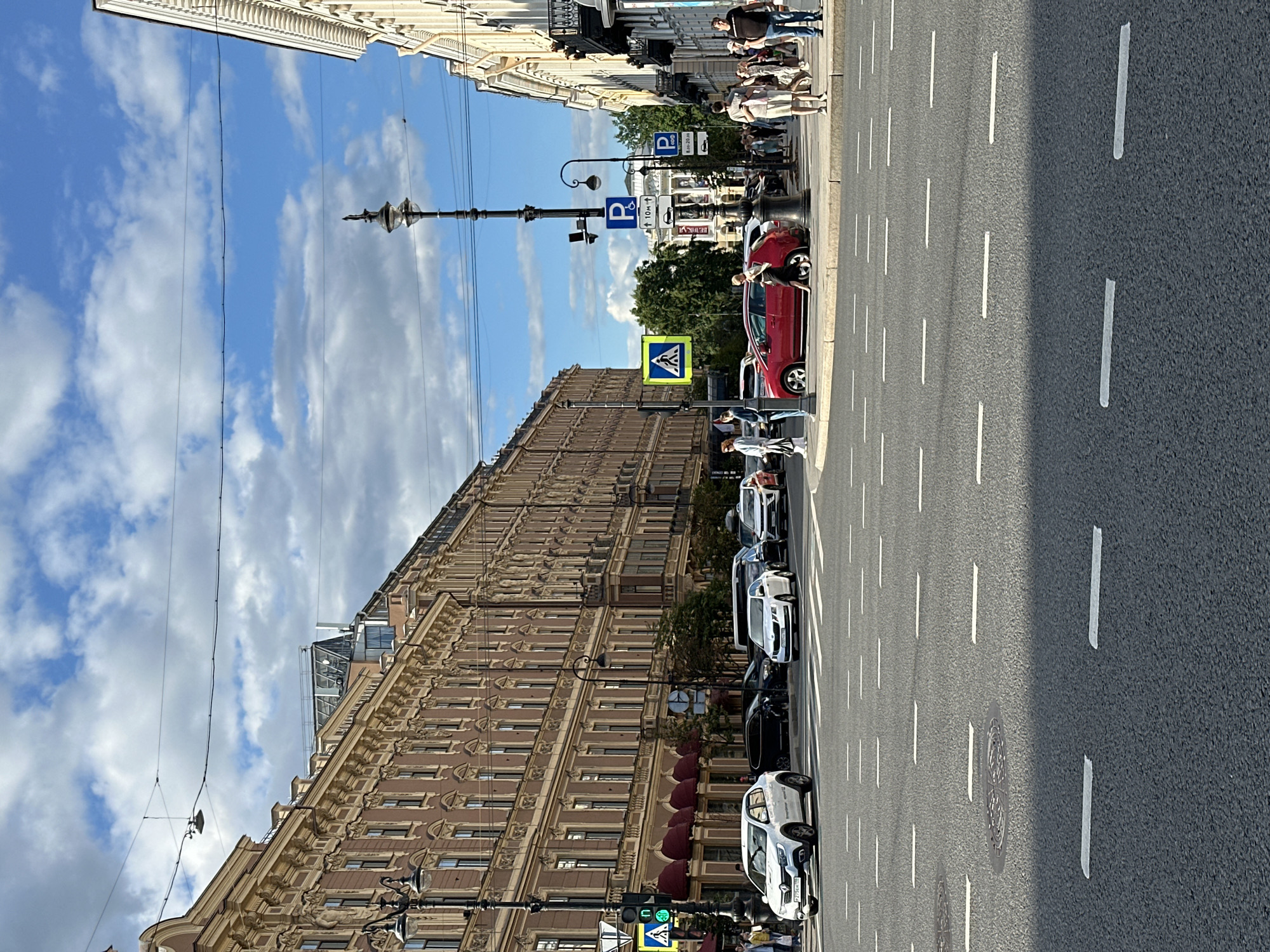 Sunny afternoon on Nevsky Prospekt, flowers and facades