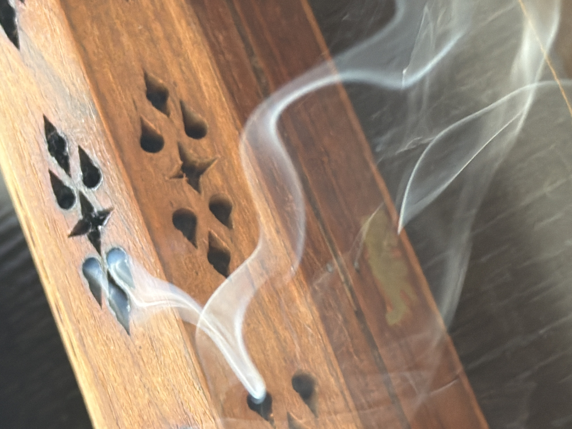 Decorative wooden incense holder burns in Cape Town