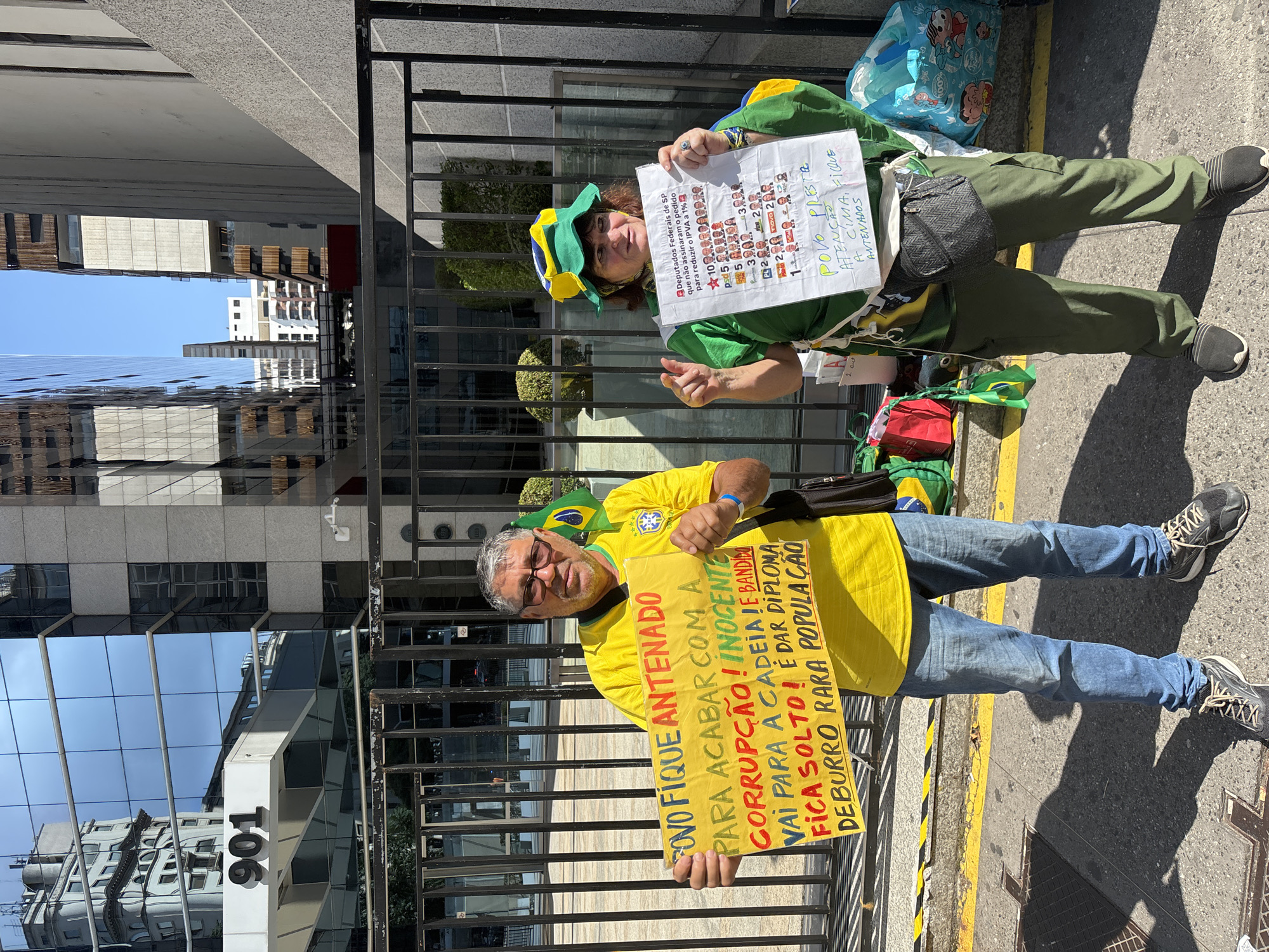 Street demonstration observed in São Paulo amid modern cityscape