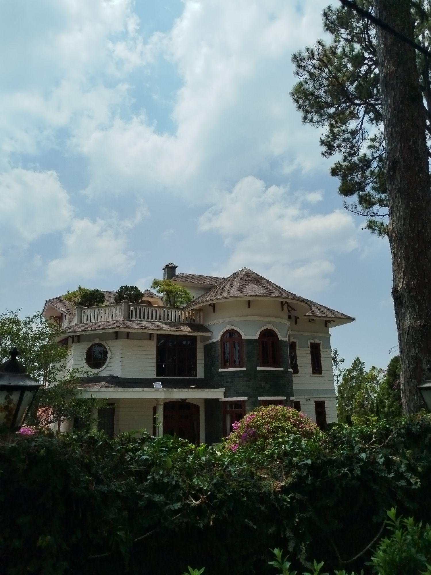 Overgrown ornate house observed in Da Lat, Vietnam