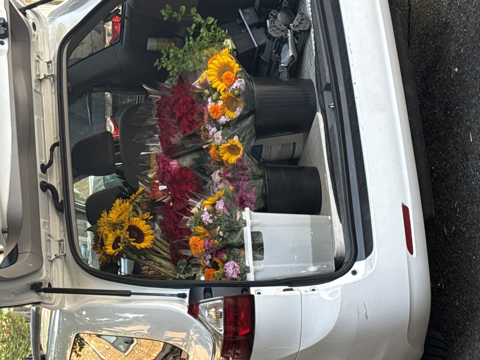 Minivan trunk loaded with fresh flower bouquets in New York