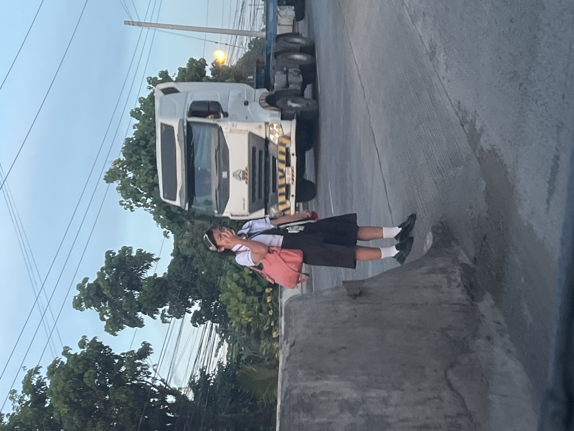 Evening highway scene in Davao City with traffic and street life