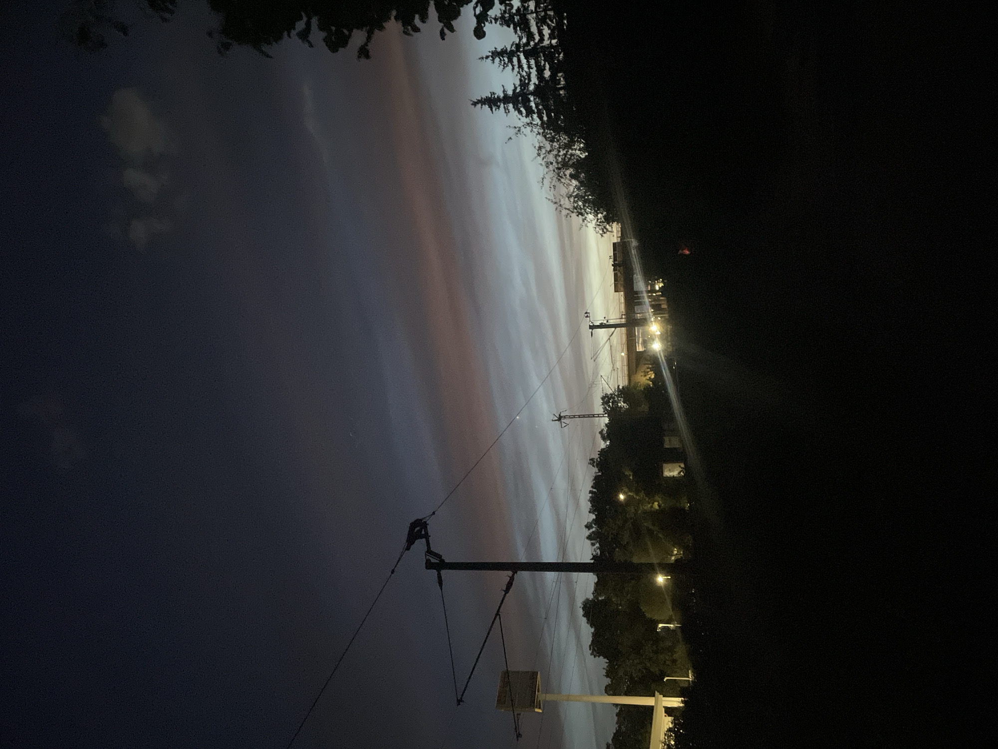 Nighttime railway maintenance operations conducted by crew teams