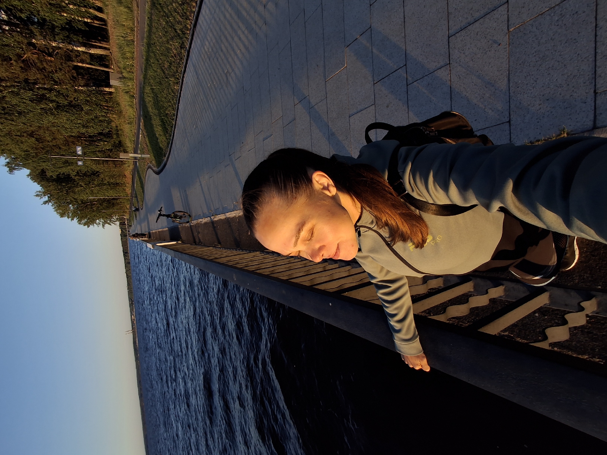 Woman documents leisurely day at Kama River waterfront in Russia