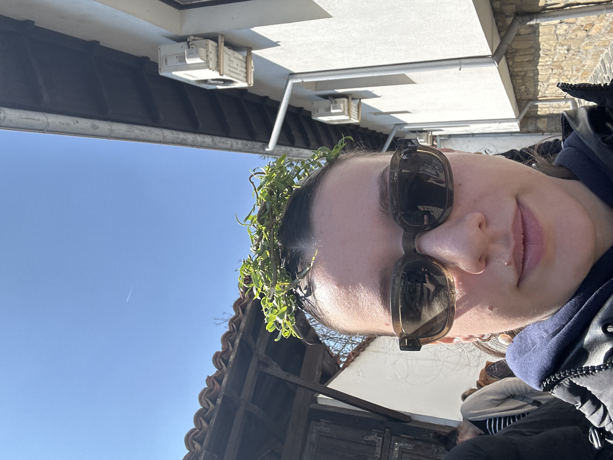 Woman takes crowned selfie in historic Arbanassi, Bulgaria