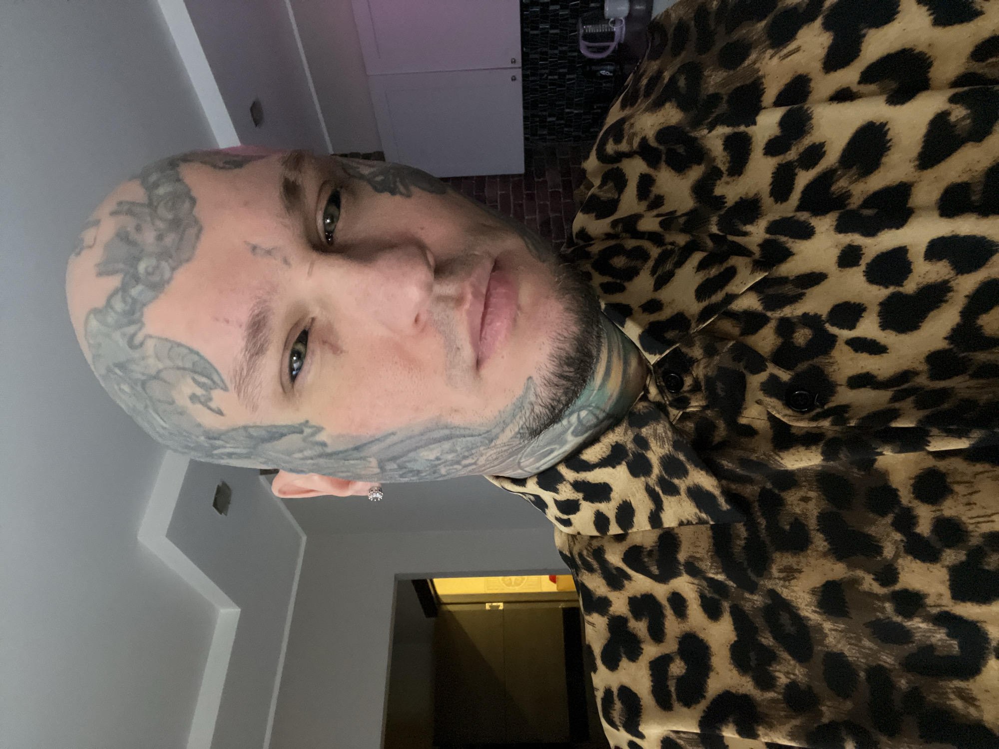 Tattooed man photographed in selfie portraits in Kudrovo, Russia