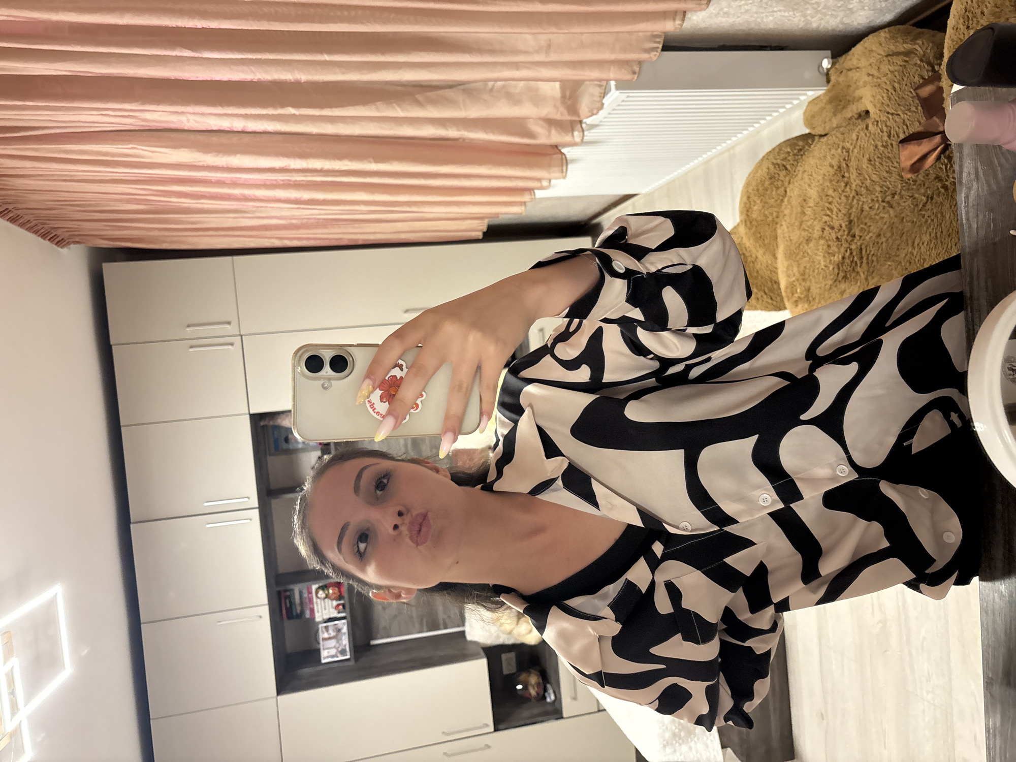 Mirror selfie session in a Bulgarovo bedroom, black and white shirt