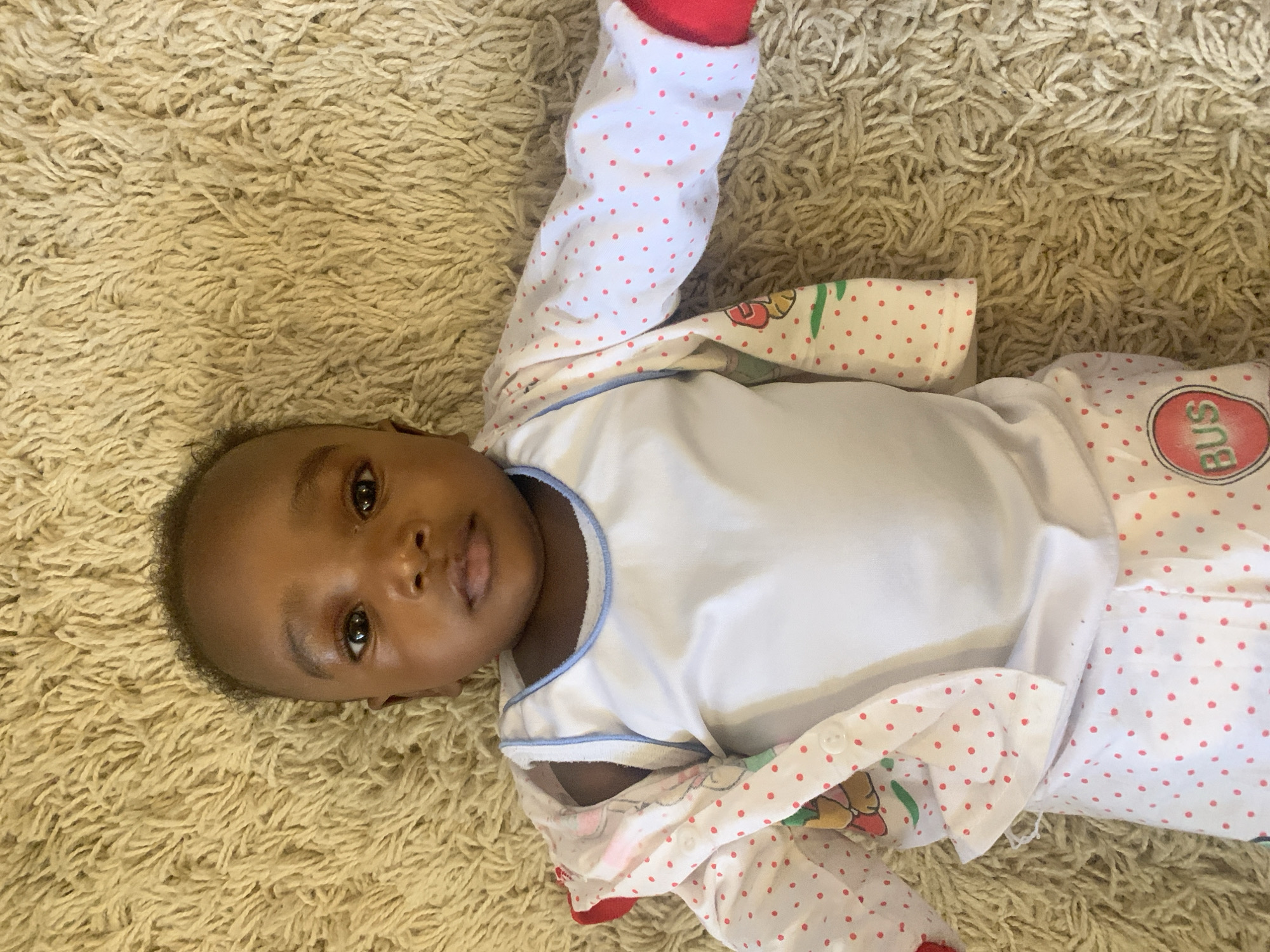 Infant observed on carpet in Barakin Akawo, Nigeria