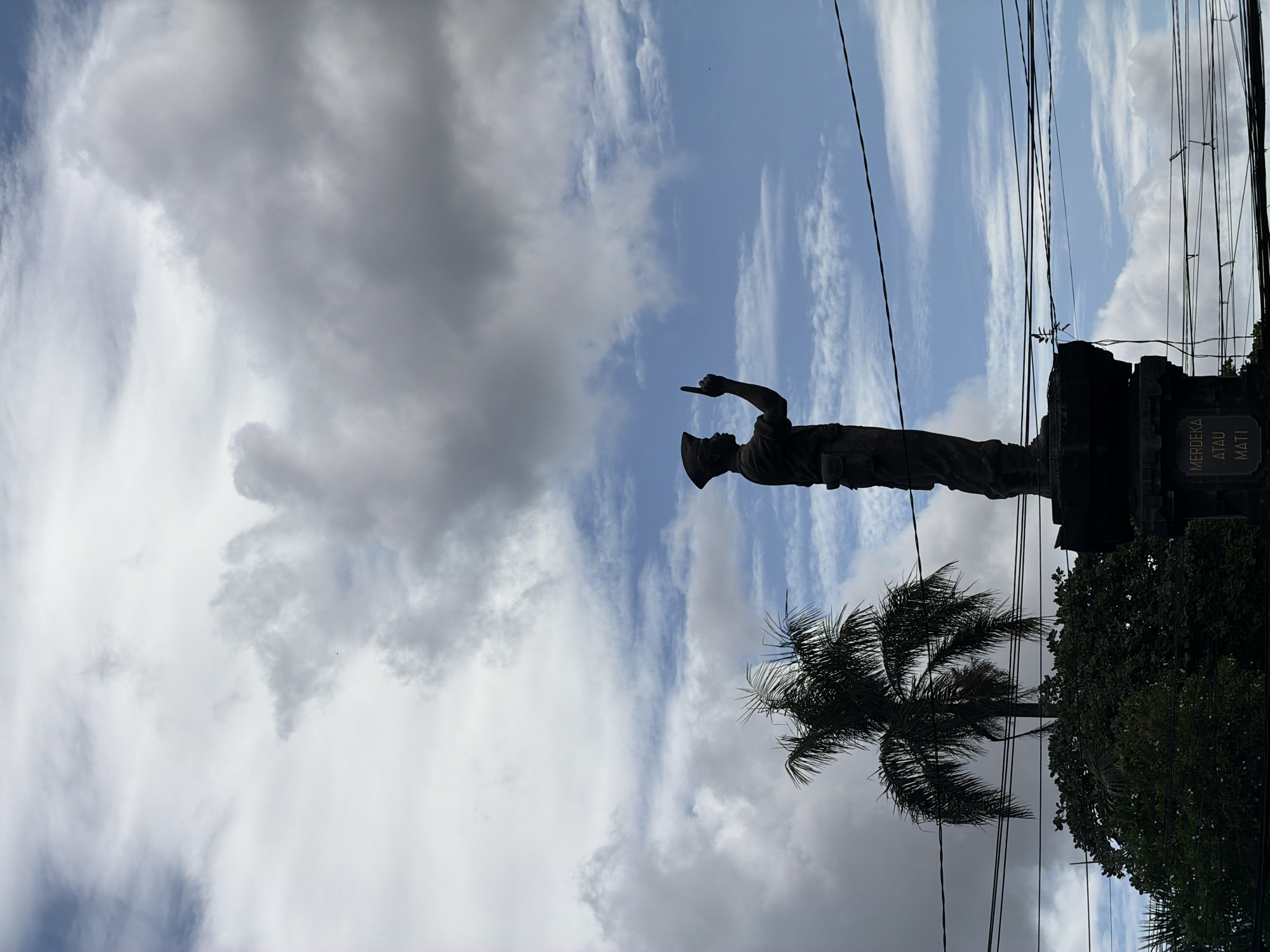 Morning traffic and statue observed in Denpasar Indonesia