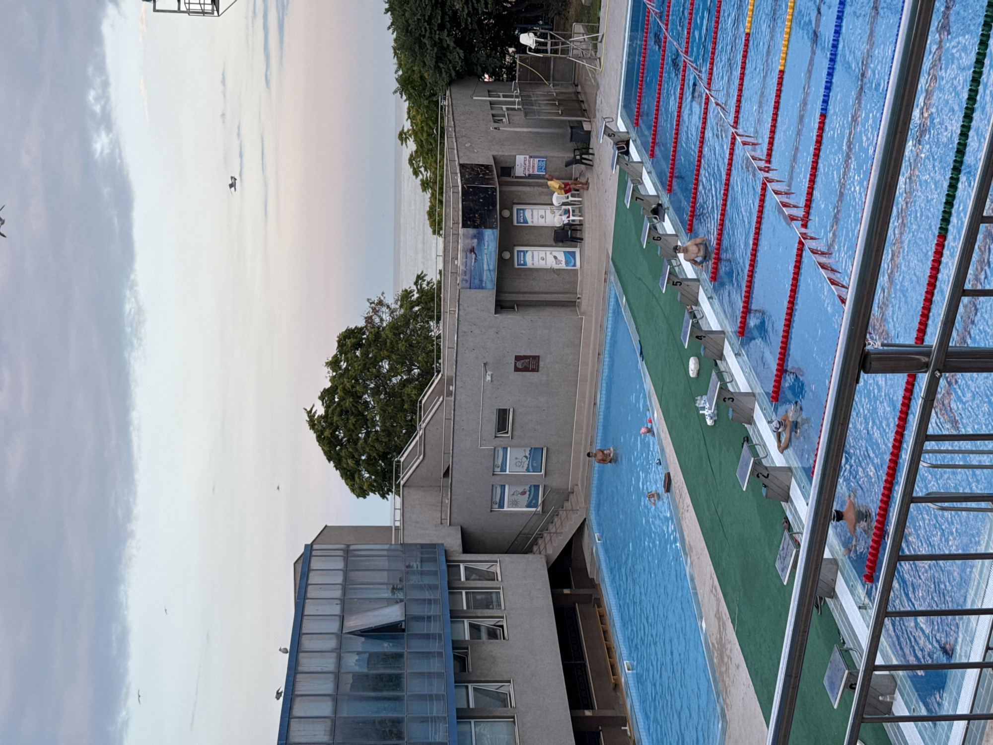 Varna summer evening: pools, a fairground, and dragon sculptures