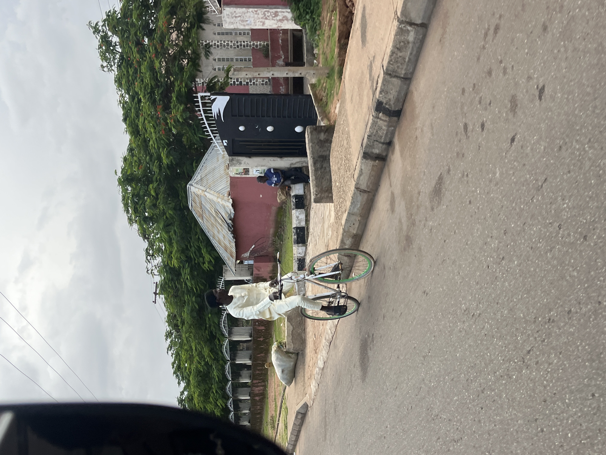 Street life and retail interiors across an evening in Bukuru, Nigeria