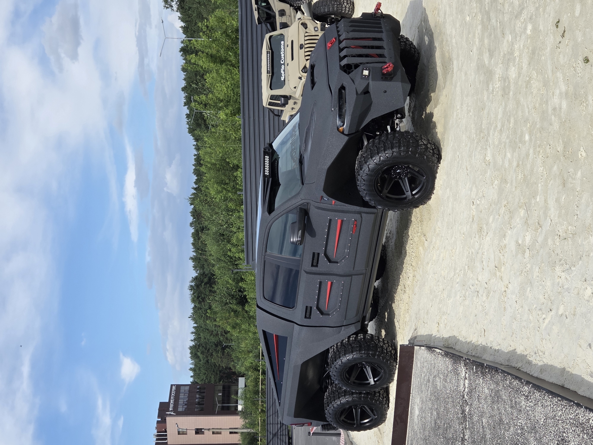 Custom off-road truck and religious bronze sculptures at Yekaterinburg event