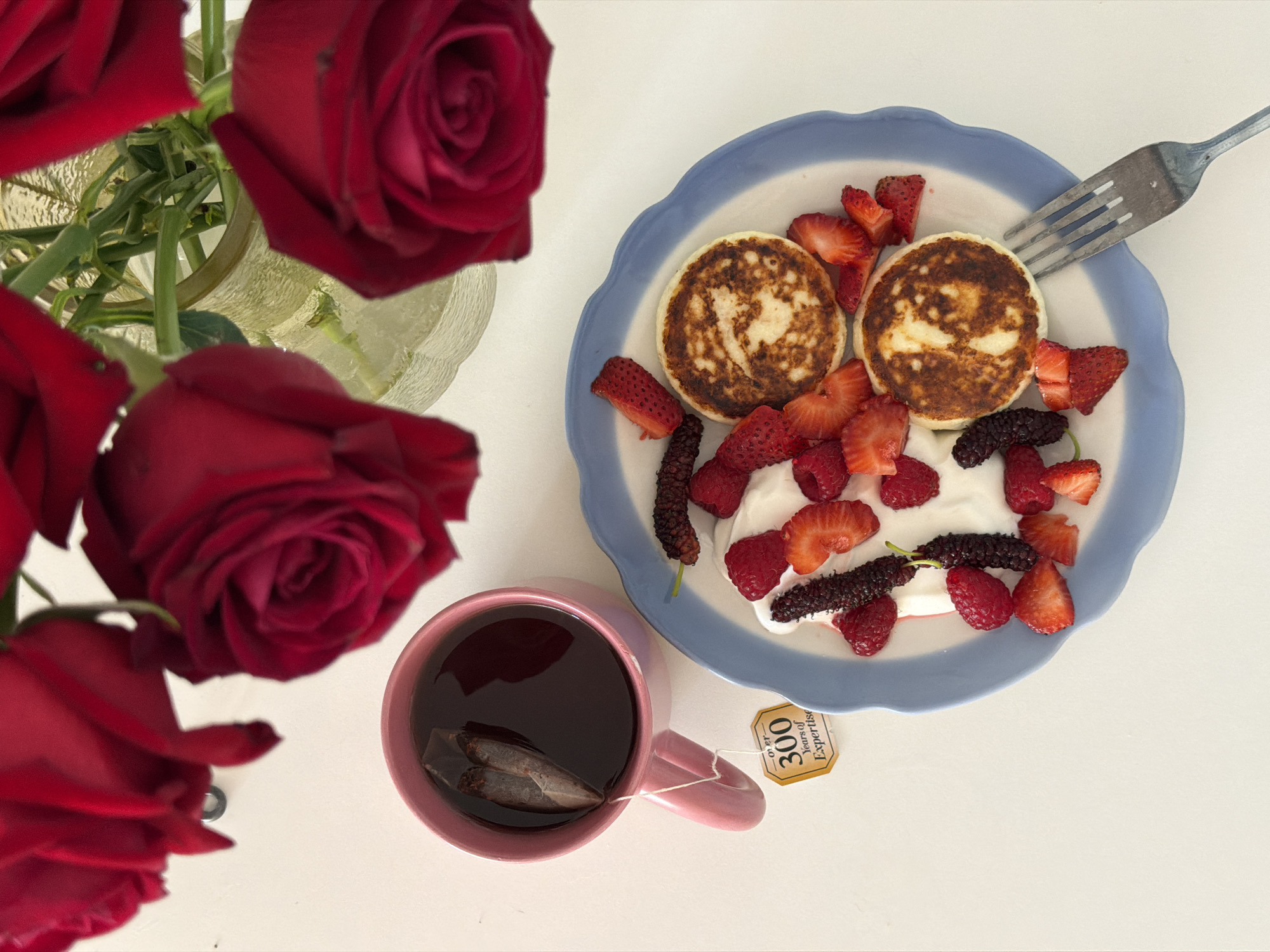 Red roses and golden items arranged in Tel Aviv still life
