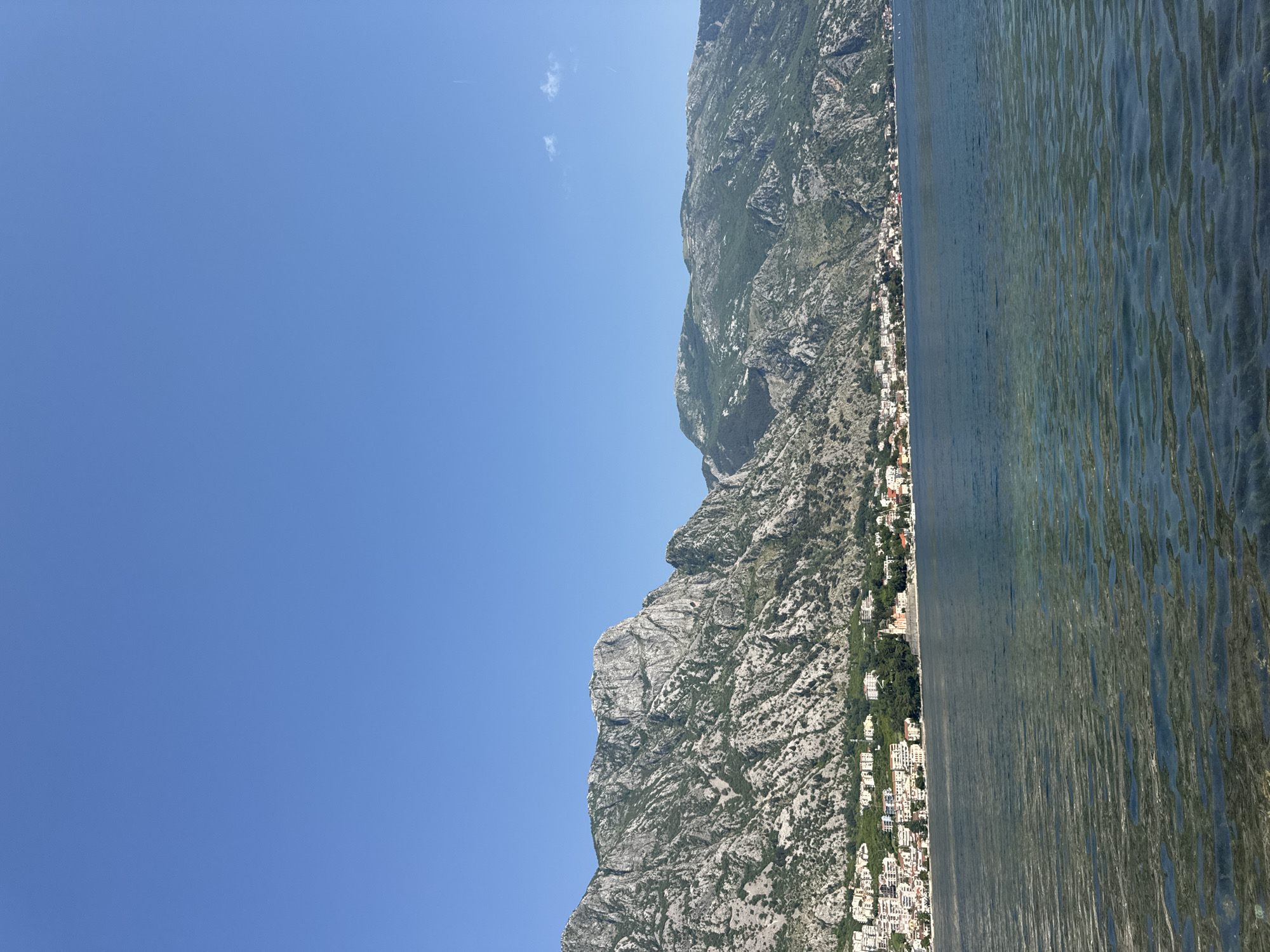 Cruise ship docks in Bay of Kotor near Prčanj