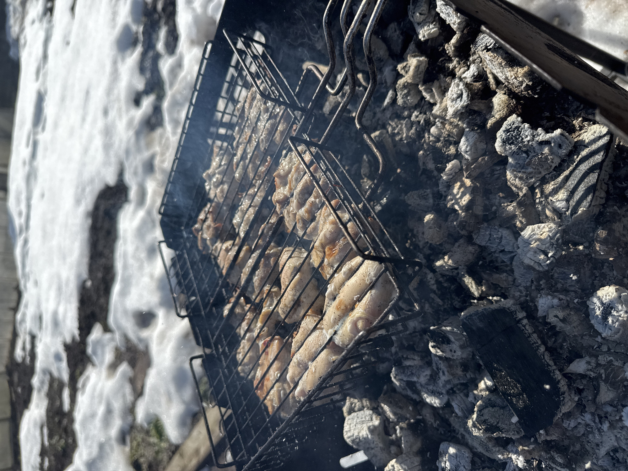 Spring grilling continues despite snow in Russian city