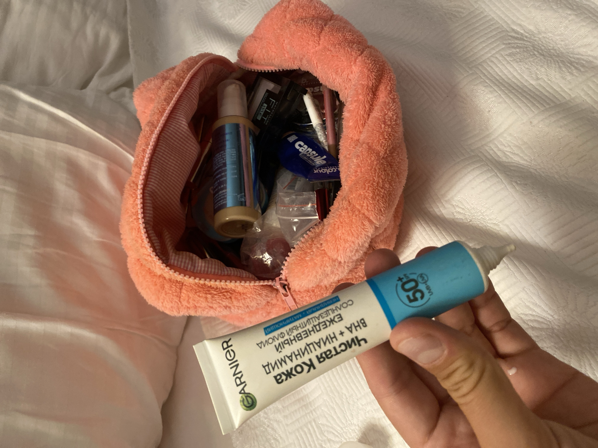 Morning SPF skincare routine documented in an Aksu bathroom