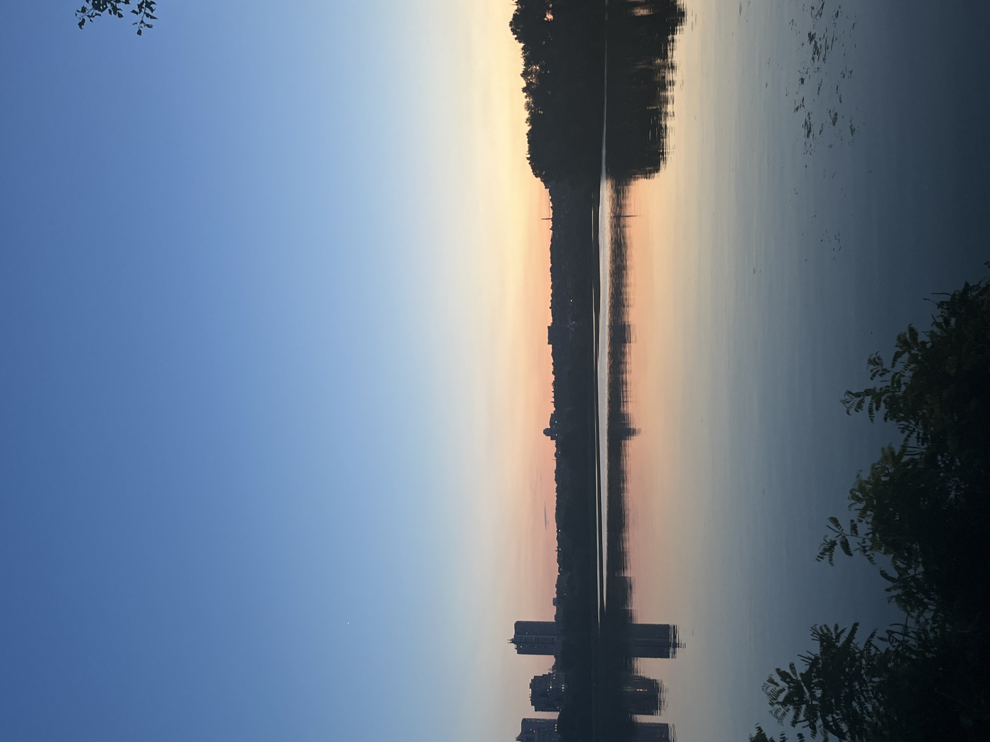 Sunset and moonrise over the Dnipro River, summer evening
