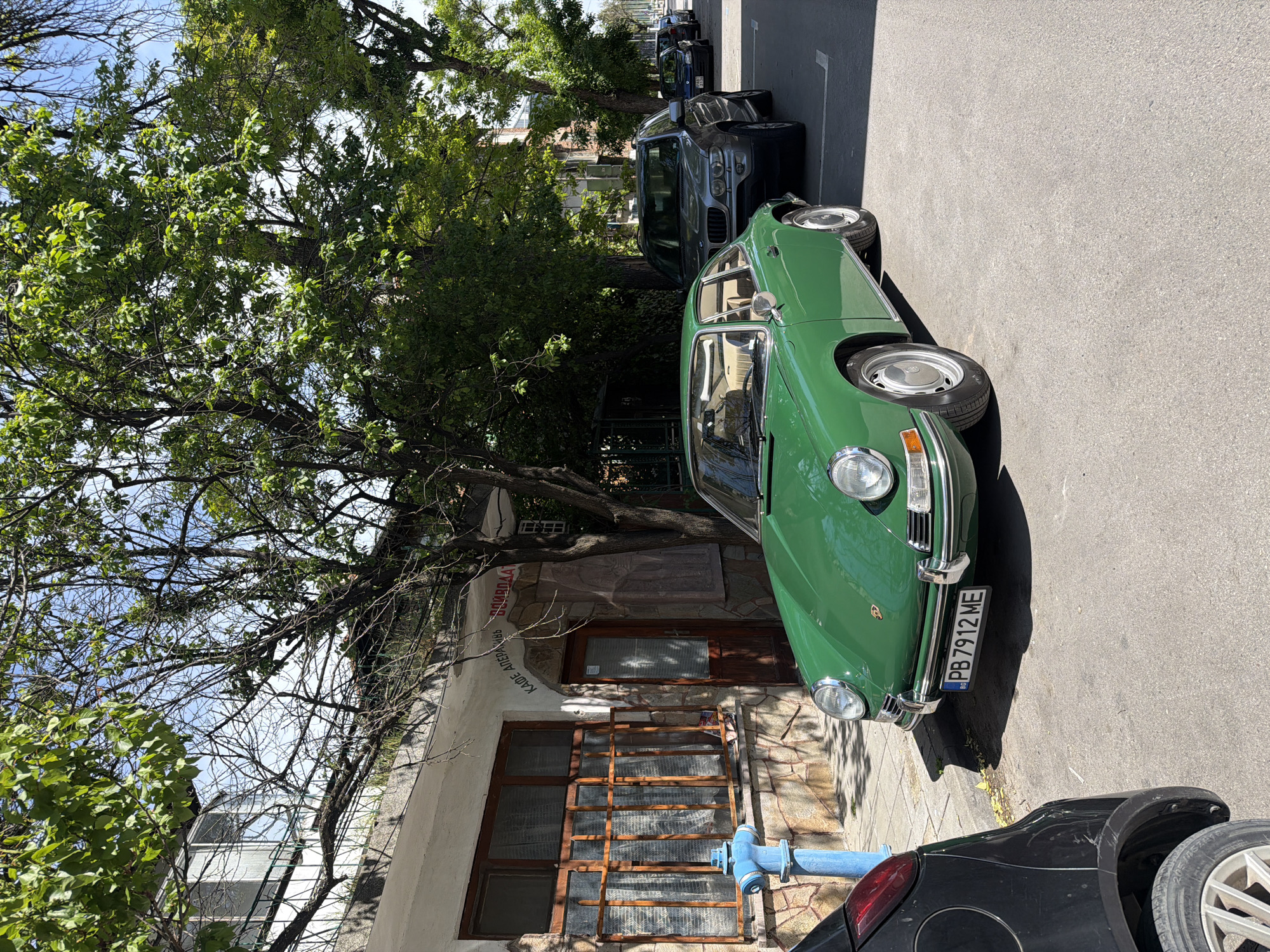 Classic green car spotted parked on city street
