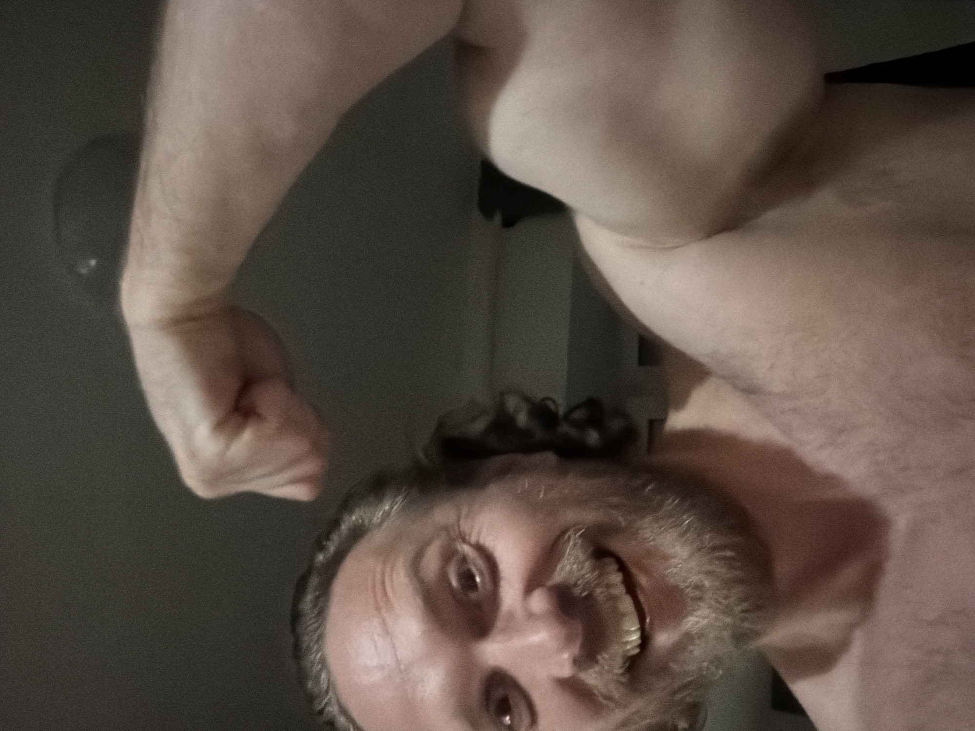 Man flexes arm indoors in Saint Petersburg