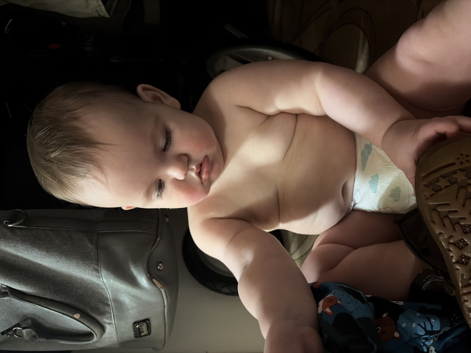 Mother documents quiet baby care moments in Russian home