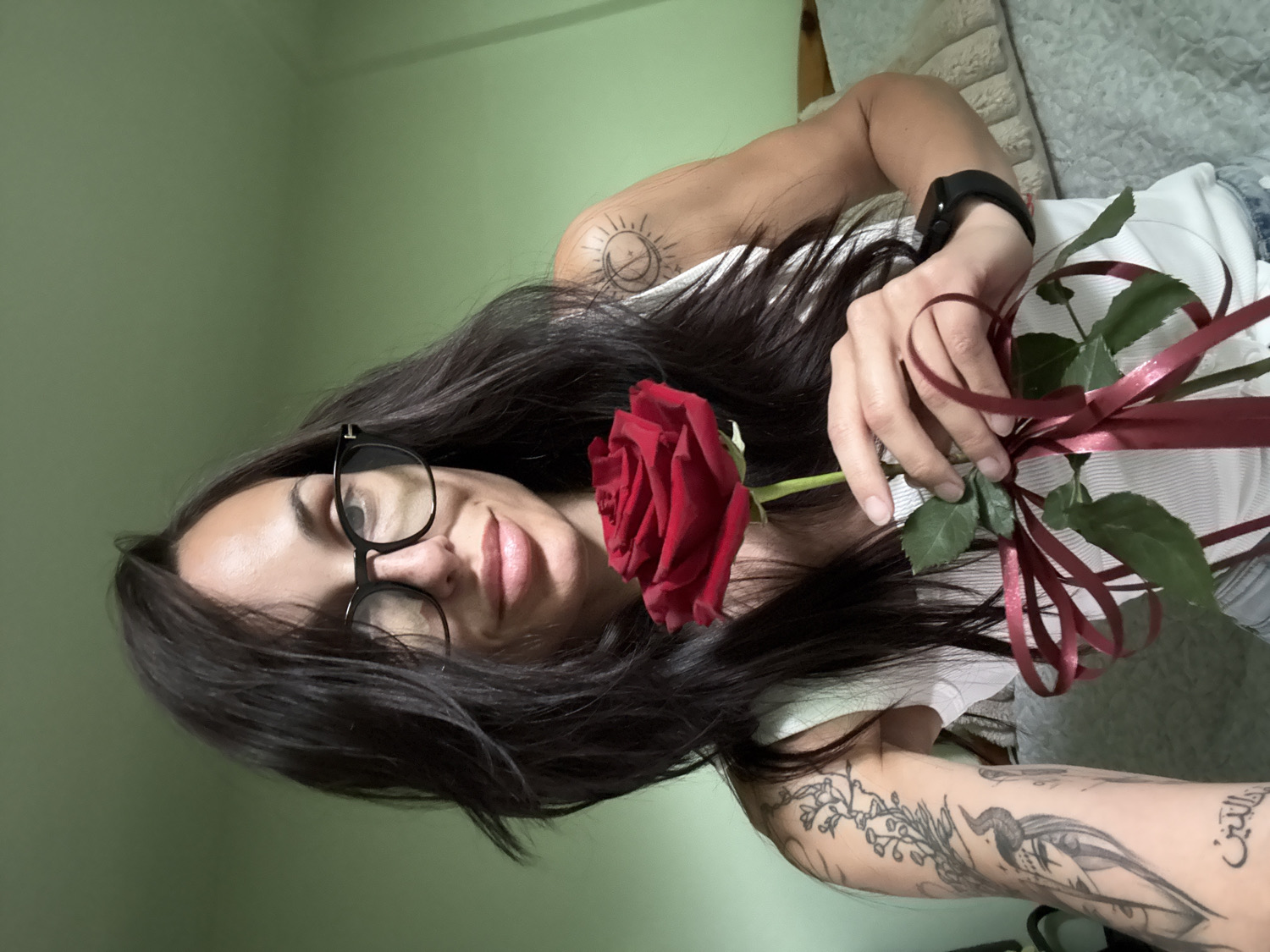 Woman photographed with rose in indoor settings, Pleven Bulgaria